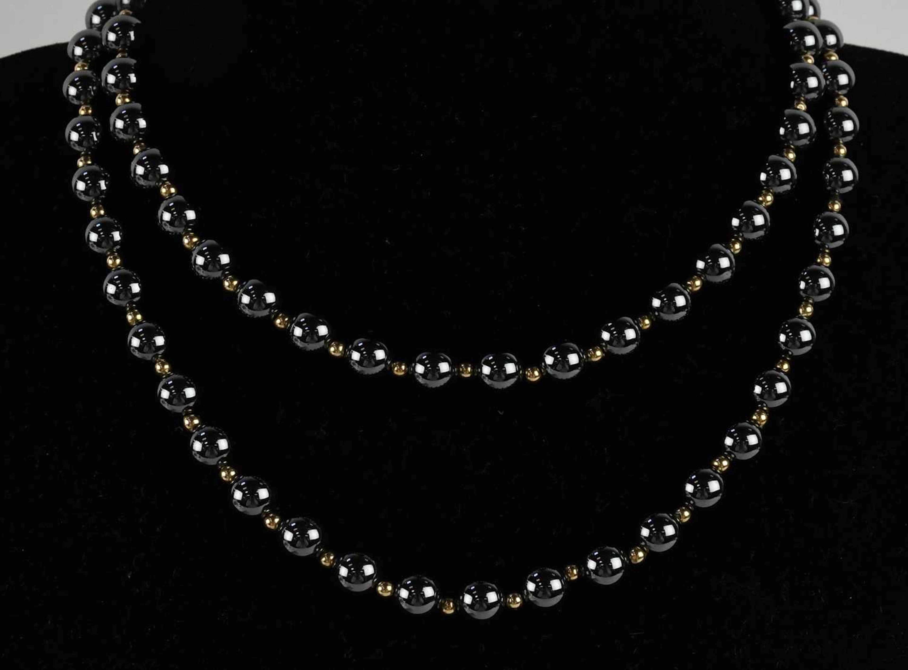 A black metallic bead single strand necklace