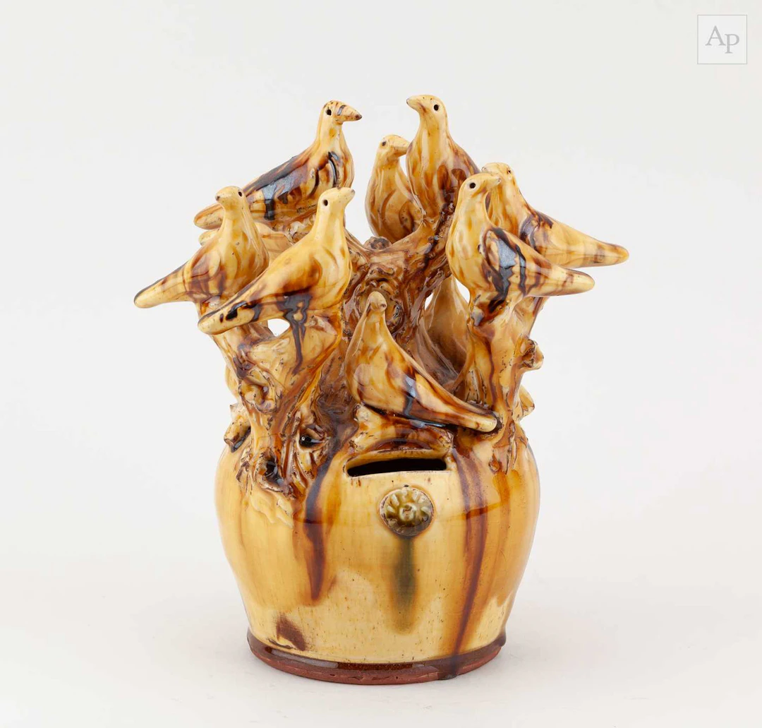 DOUG FITCH (born 1964); a slipware moneybox surmounted by birds