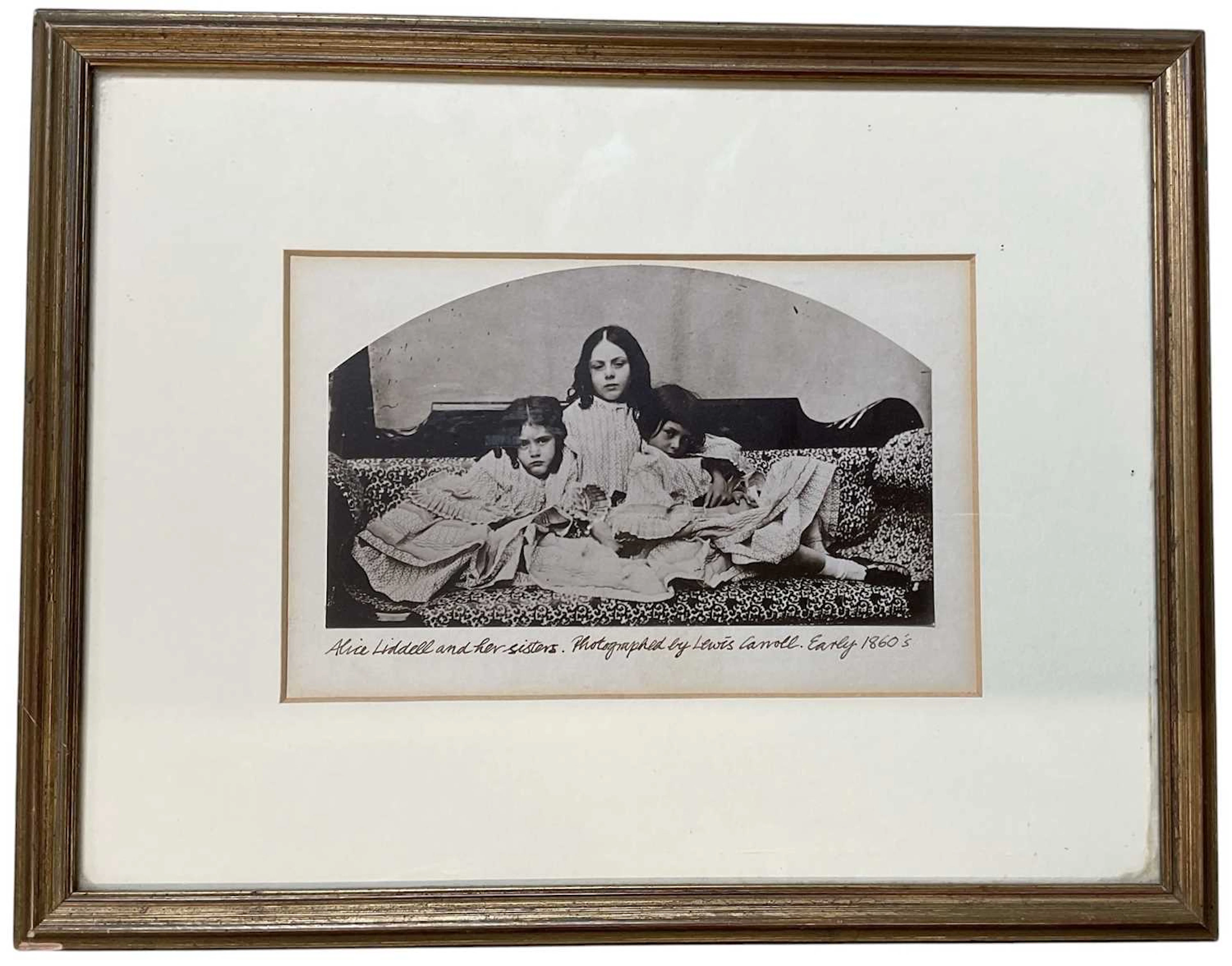 A mid 19th century black and white photograph of Alice Liddell and her sisters
