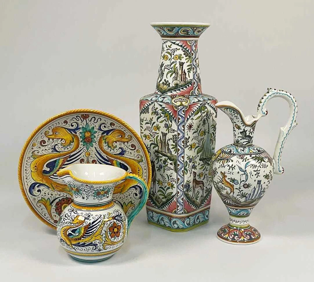 A Portuguese decorative ceramic vase and matching ewer