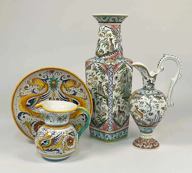 A Portuguese decorative ceramic vase and matching ewer