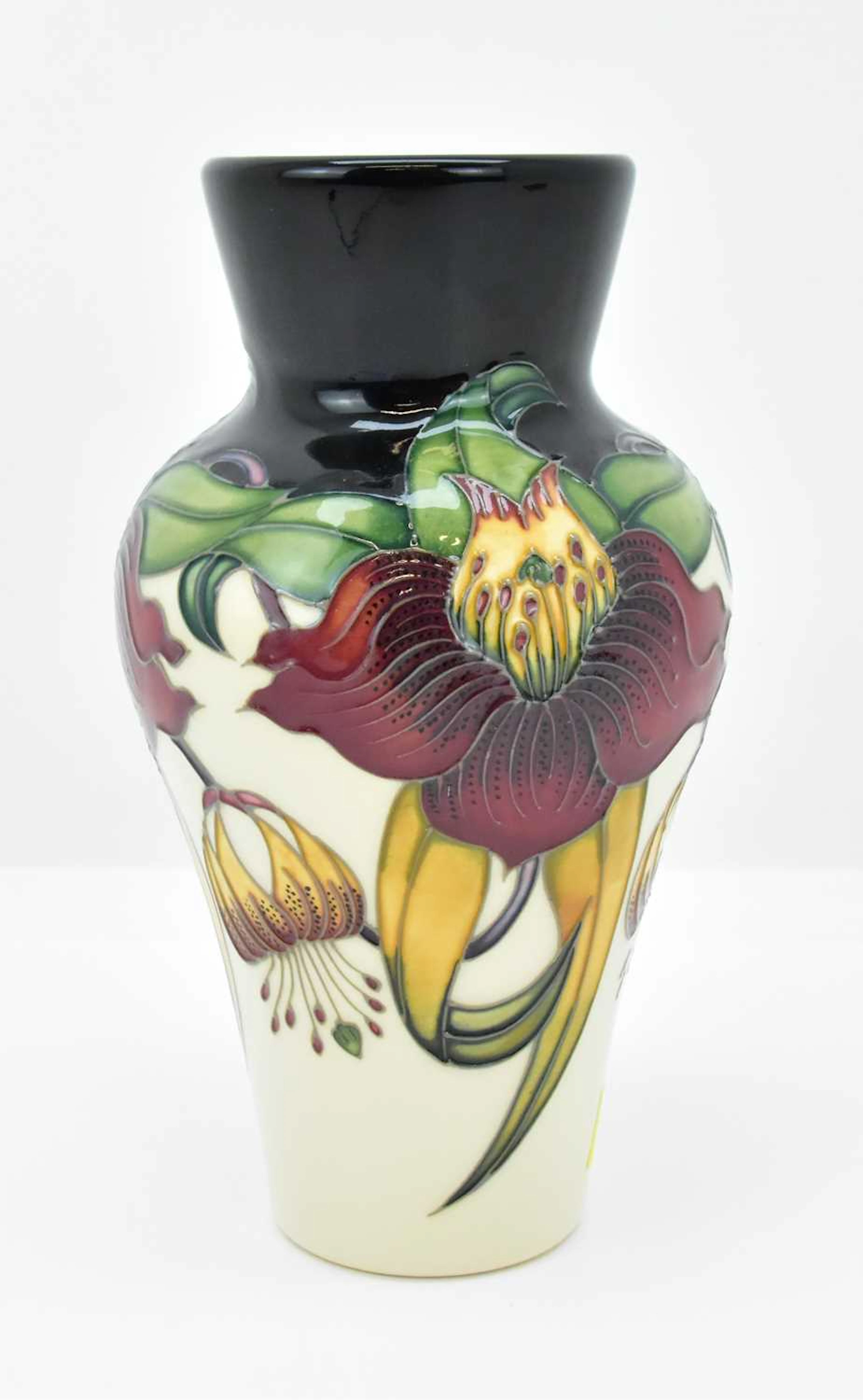 MOORCROFT; an 'Anna Lily' pattern vase of tapered form