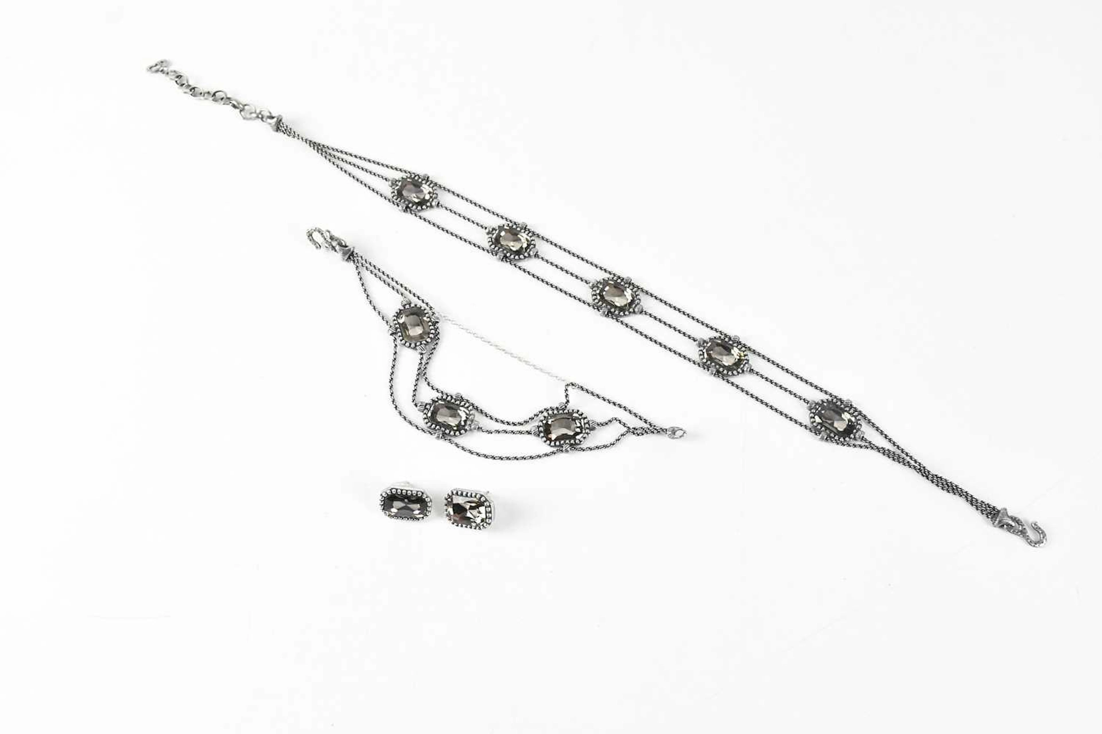 CHRISTIAN DIOR; a gunmetal jewellery set consisting of a...