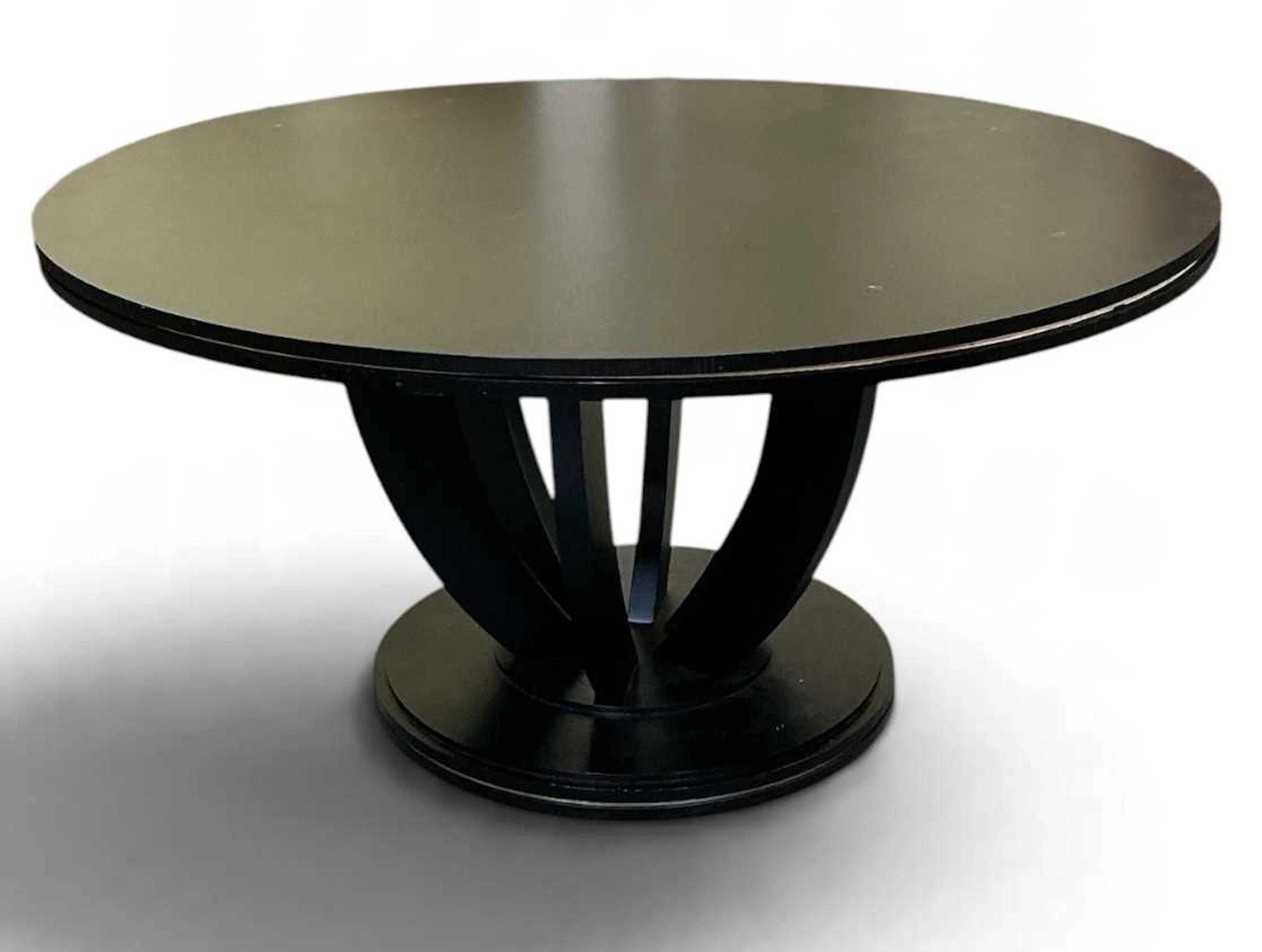 A large modern contemporary circular topped ebonised dining table