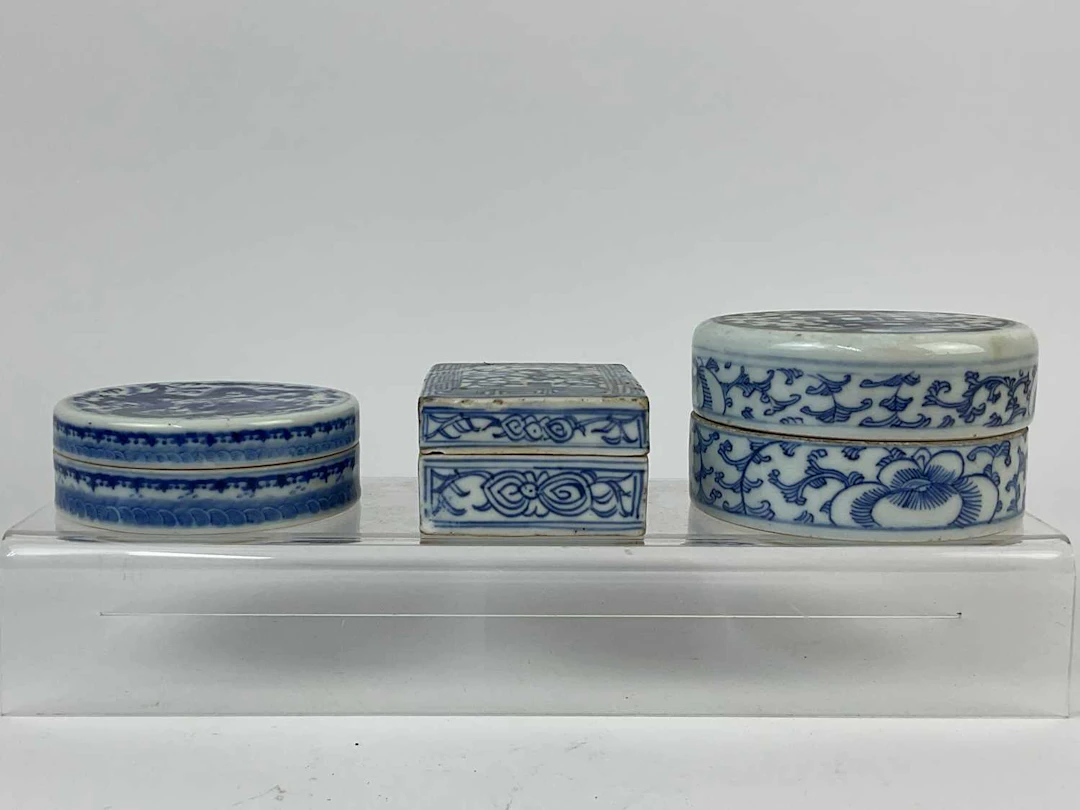 Three blue and white Chinese porcelain circular and rectangular lidded boxes