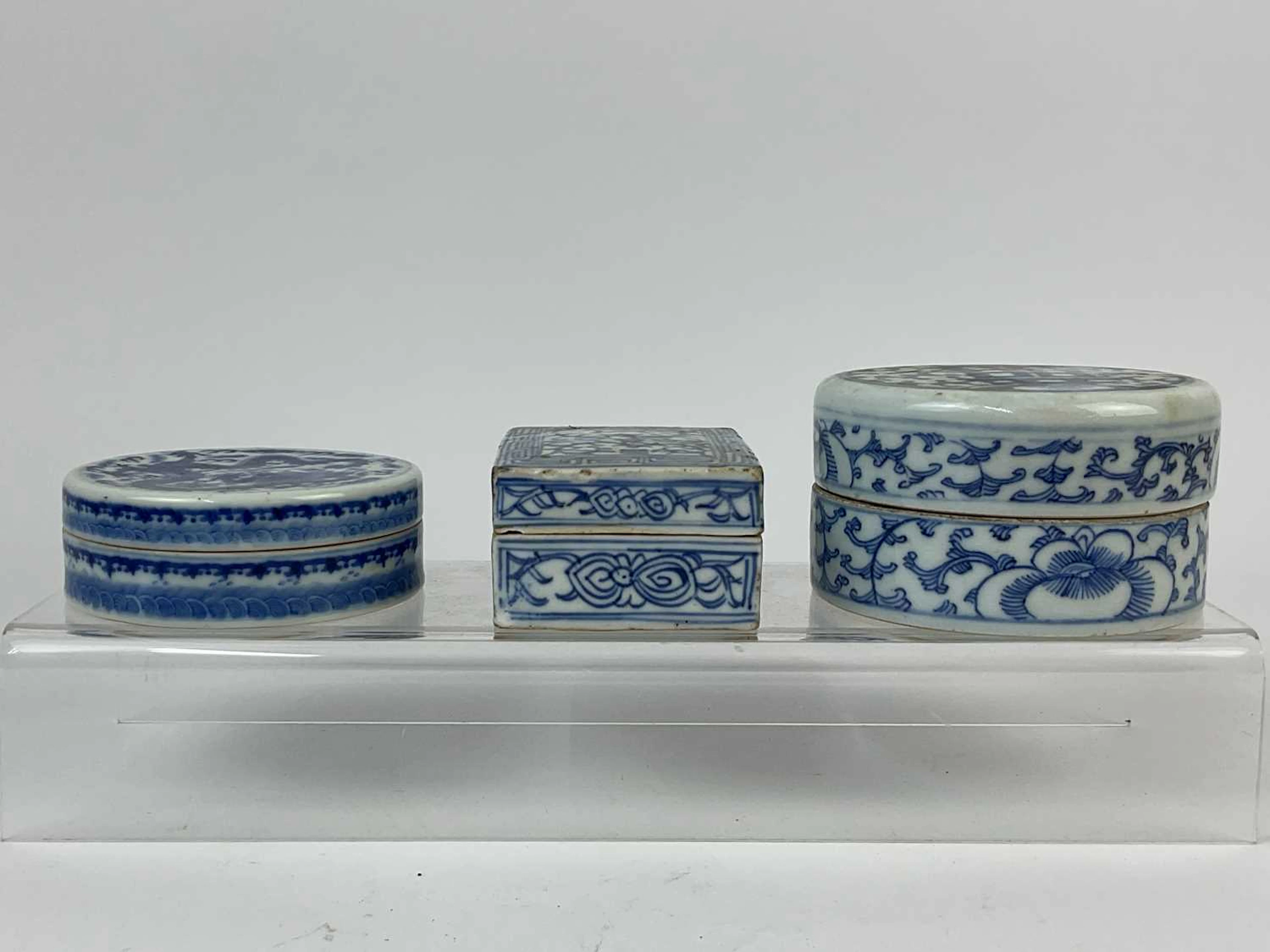Three blue and white Chinese porcelain circular and rectangular lidded boxes