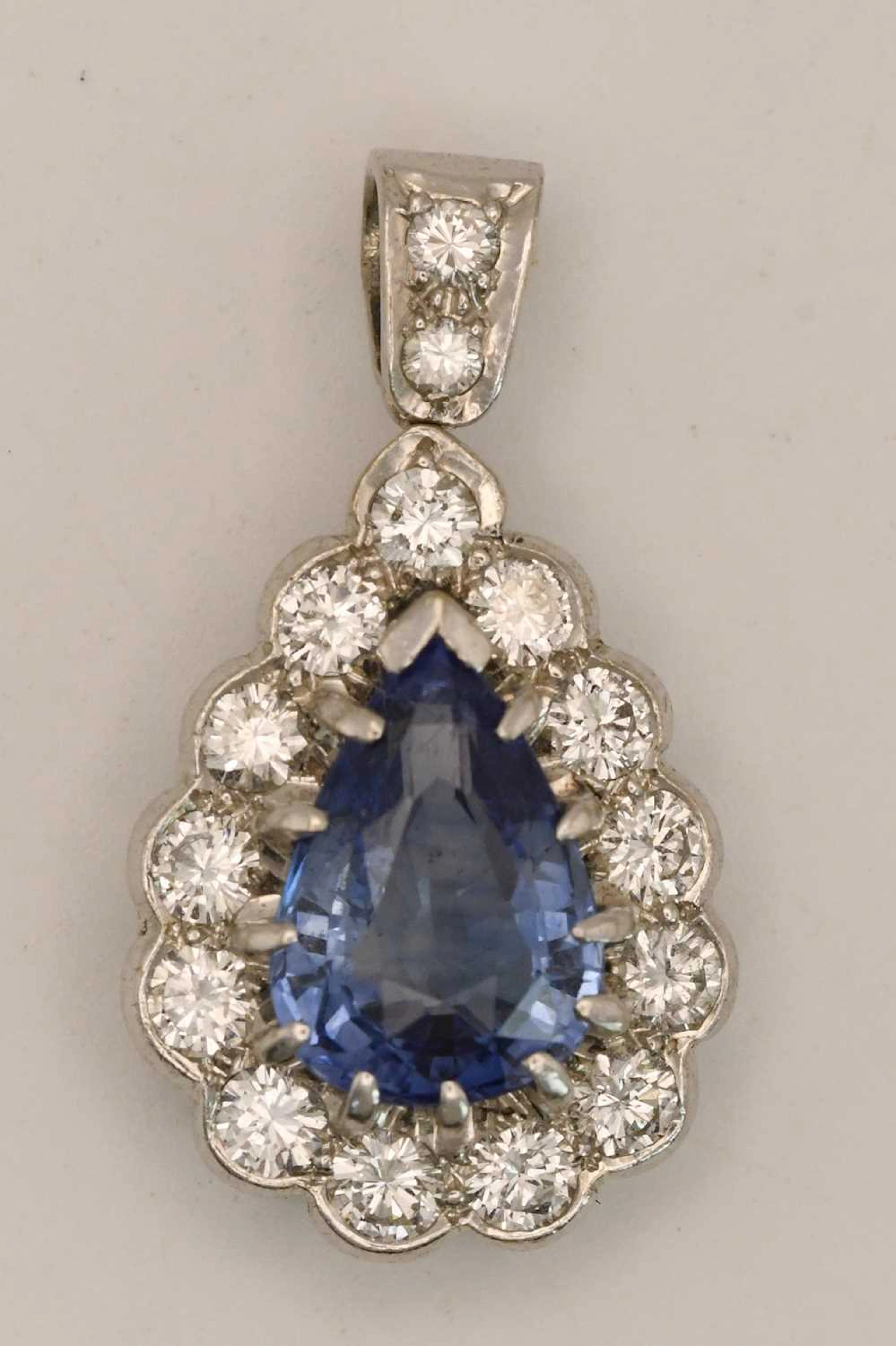 An 18ct white gold sapphire and diamond pendant