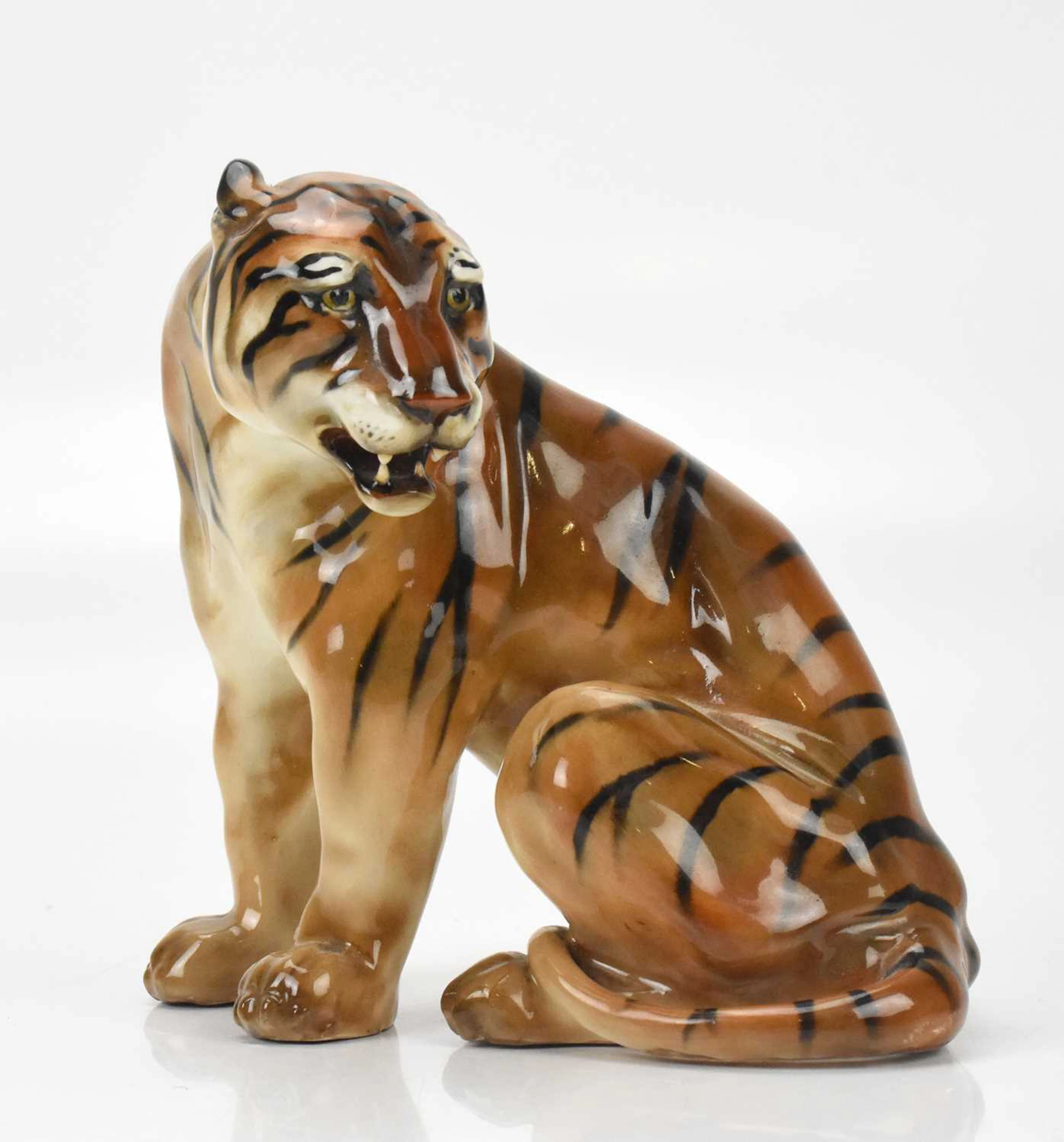CHARLES NOKE FOR ROYAL DOULTON; a rare model of a seated tiger