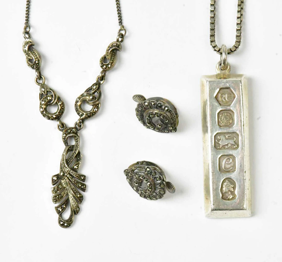 A hallmarked silver ingot pendant
