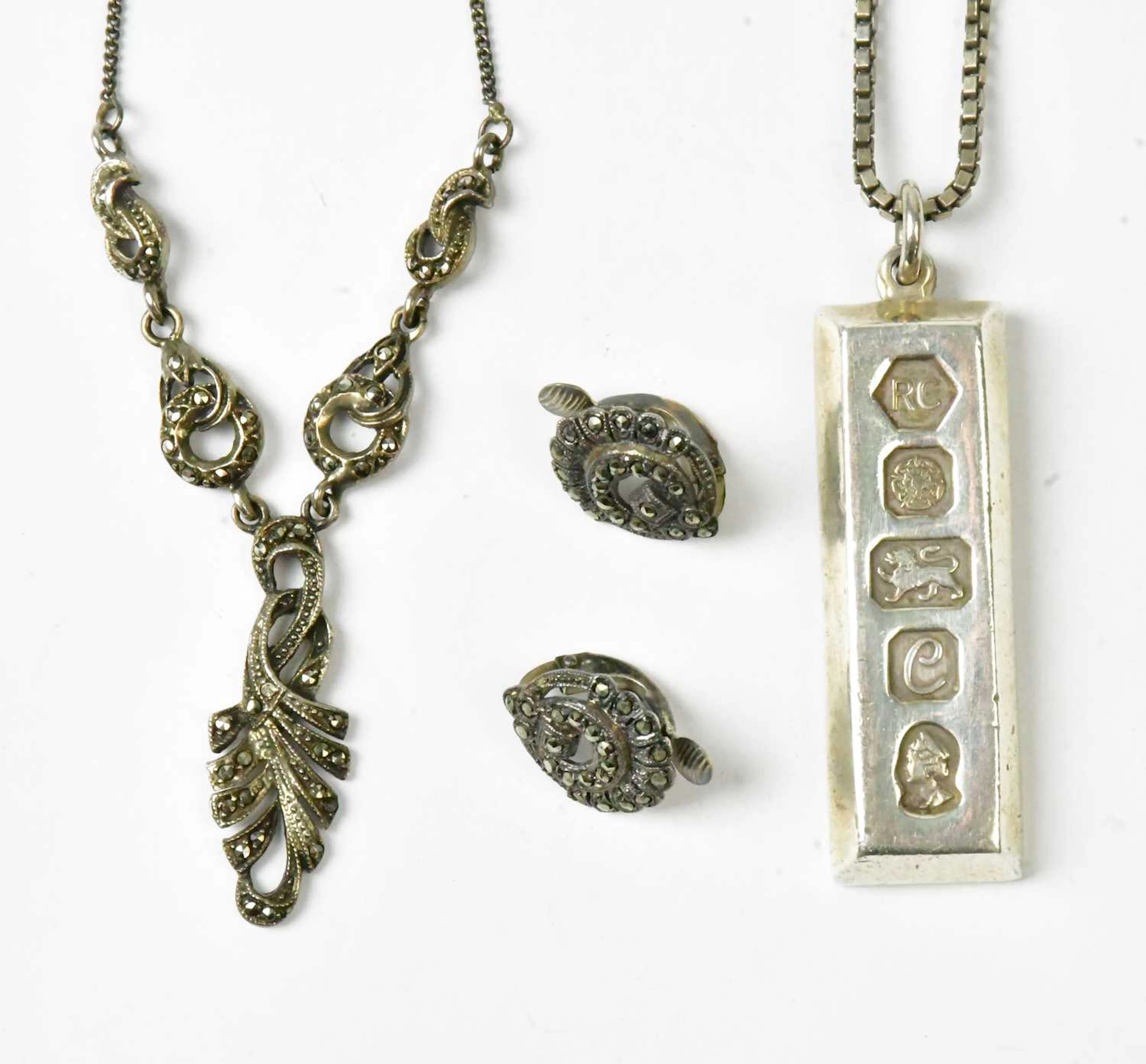 A hallmarked silver ingot pendant