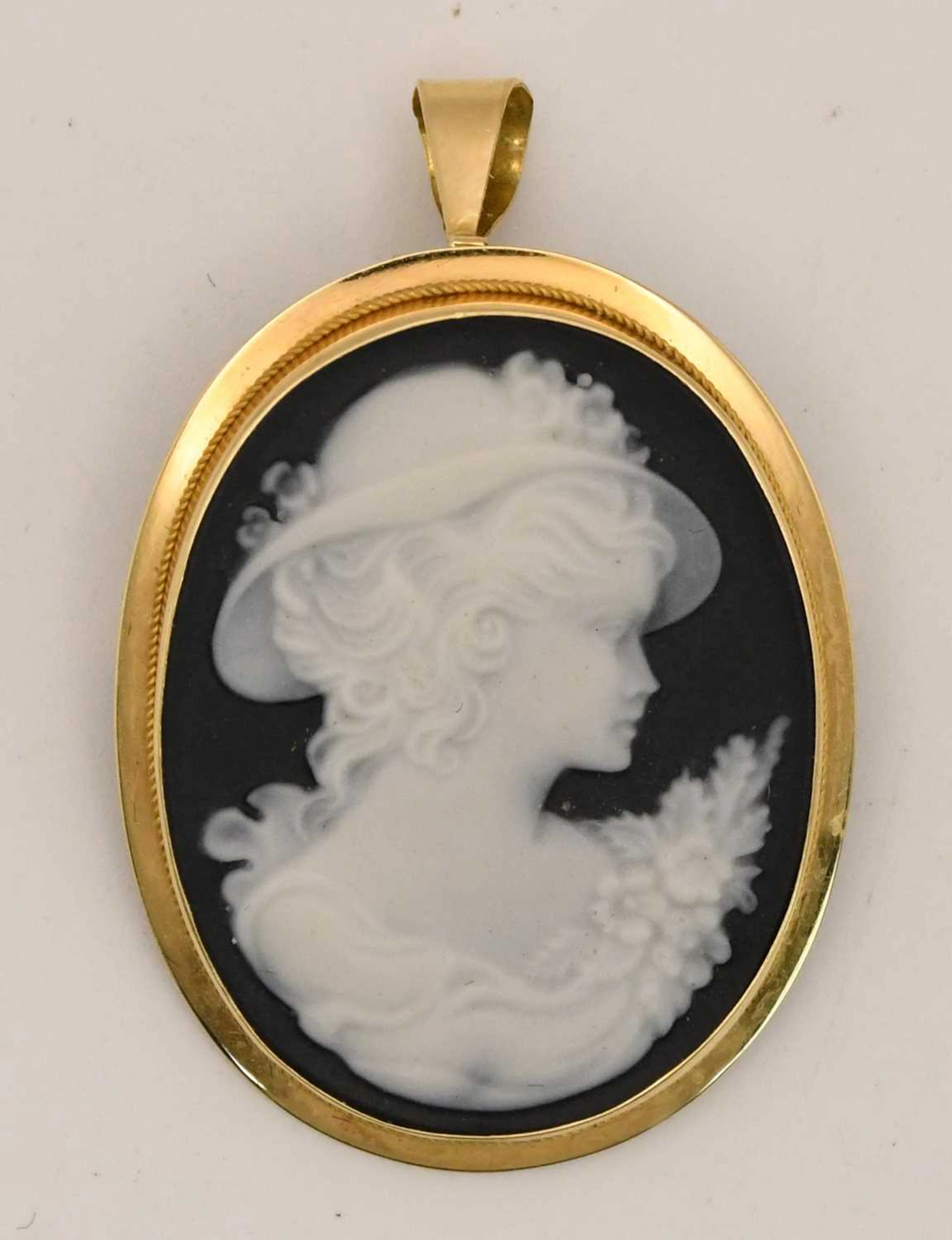 A cameo pendant depicting the head and shoulders of an...