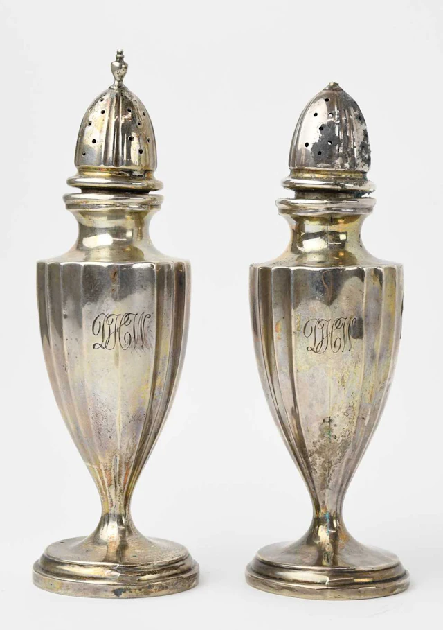 A pair of early 20th century sterling silver salt and pepper shakers