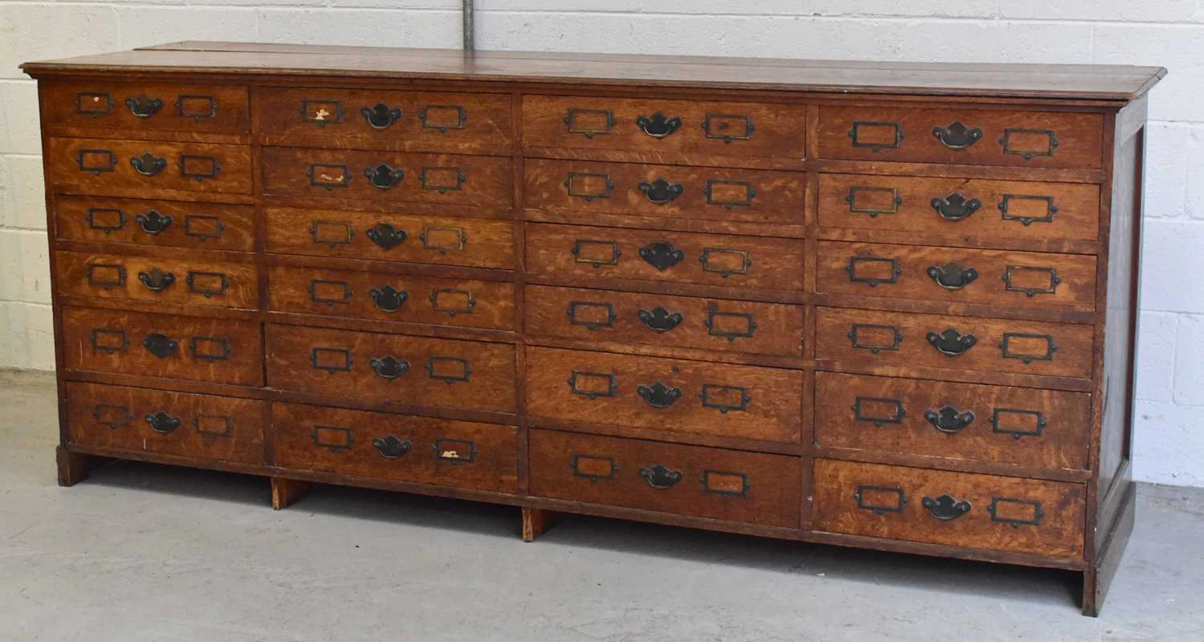 A Victorian oak library/catalogue cabinet of twenty-four drawers