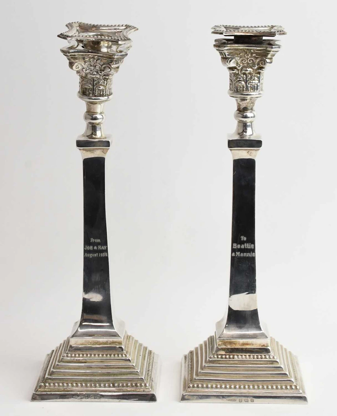 A pair of George VI hallmarked silver taper candlesticks