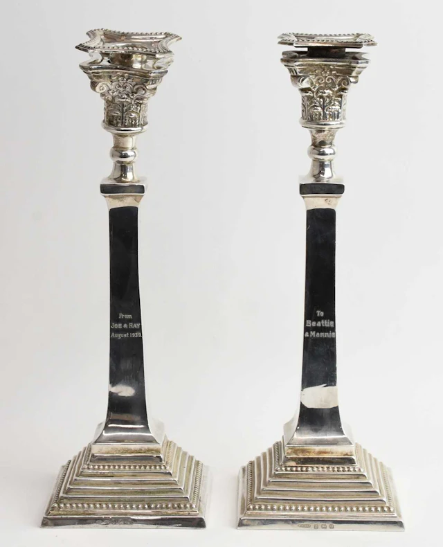 A pair of George VI hallmarked silver taper candlesticks