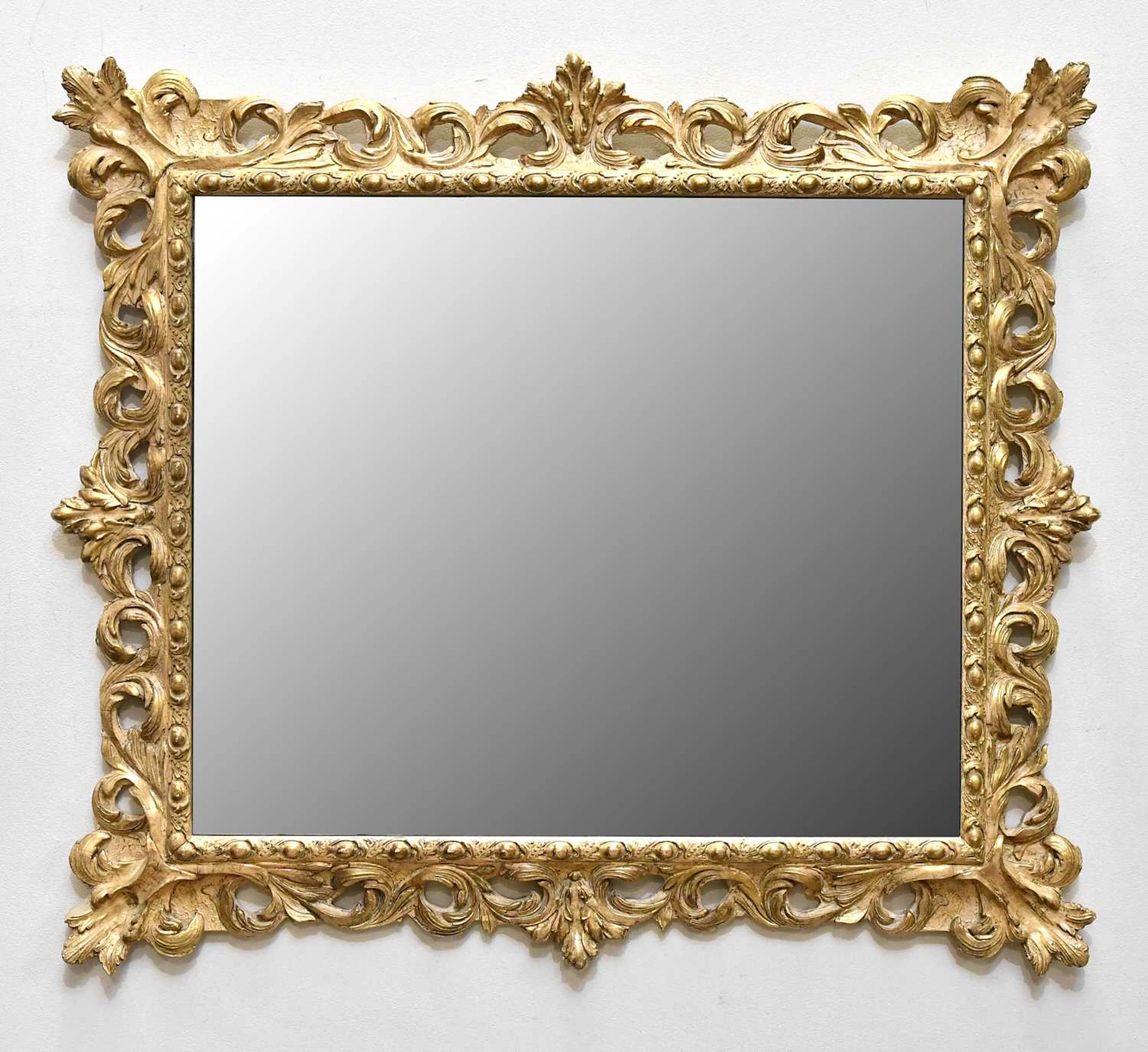 A modern Florentine style carved and gilt wall mirror