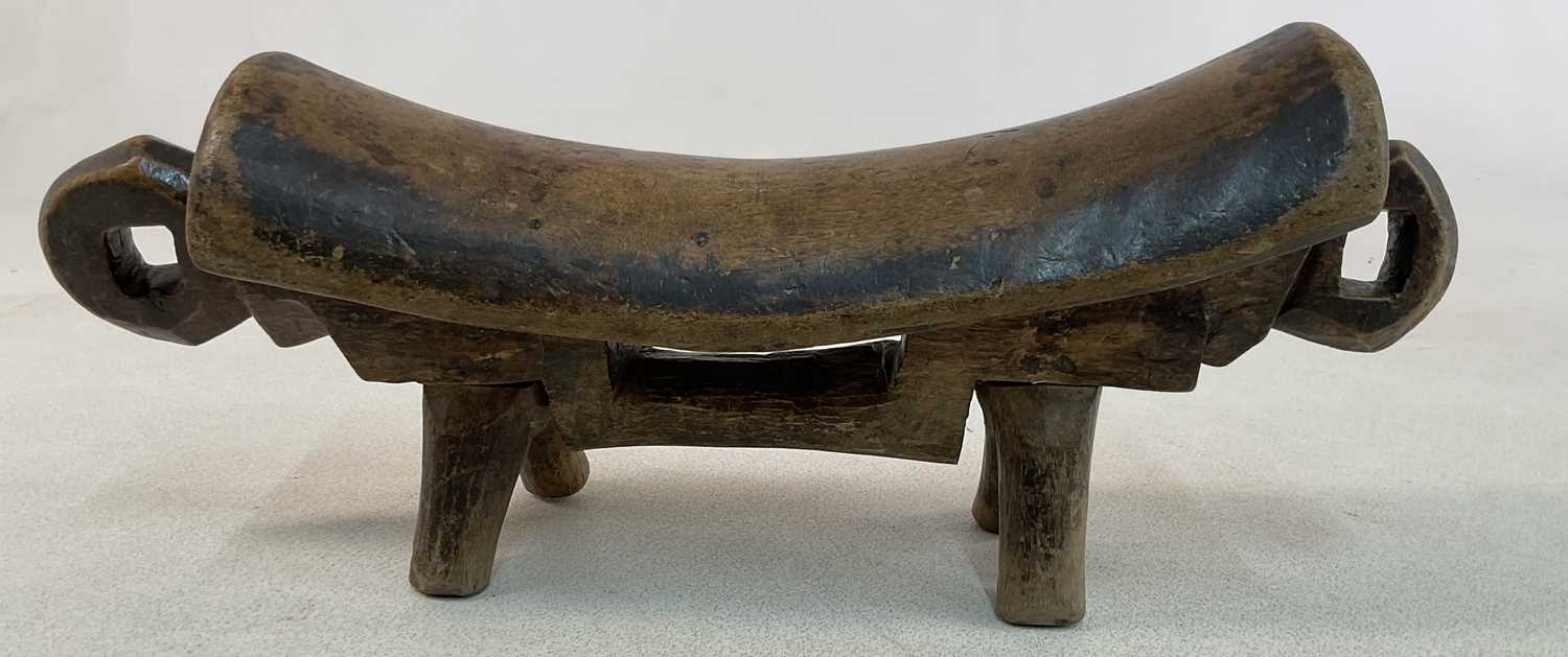 An African Sudanese carved wooden Dinka (Rex) headrest/shield