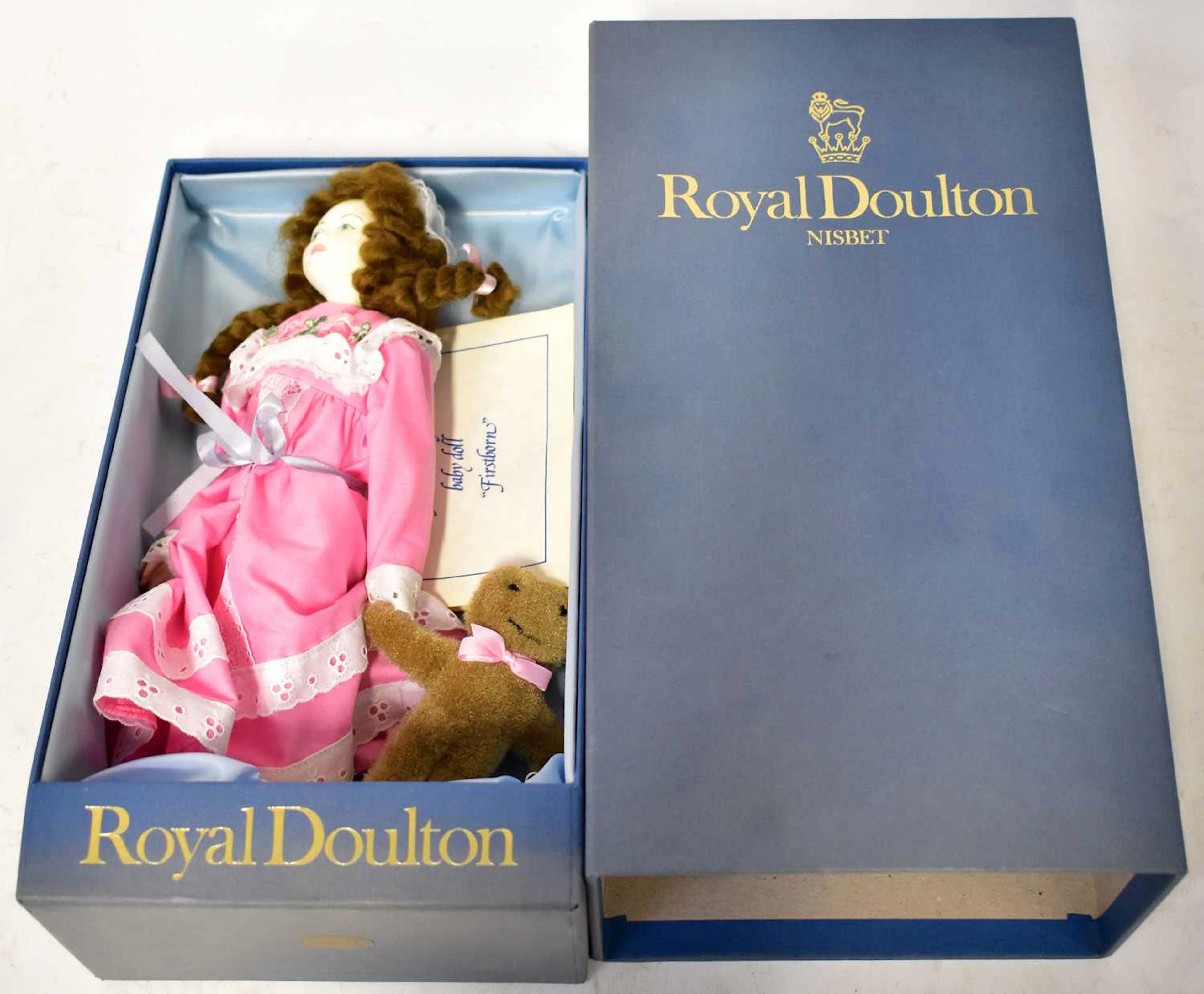 ROYAL DOULTON & HOUSE OF NISBET; a porcelain doll dressed...