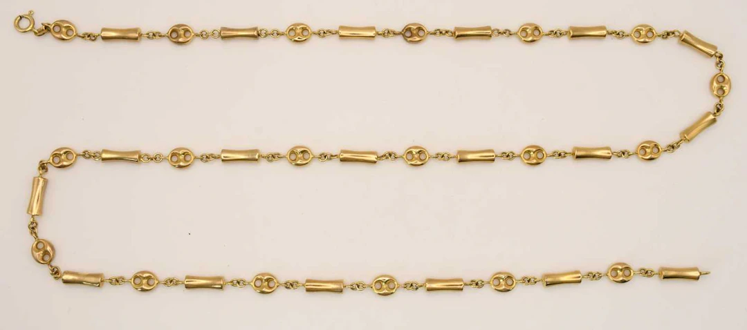 A 9ct yellow gold necklace consisting of pillow and...
