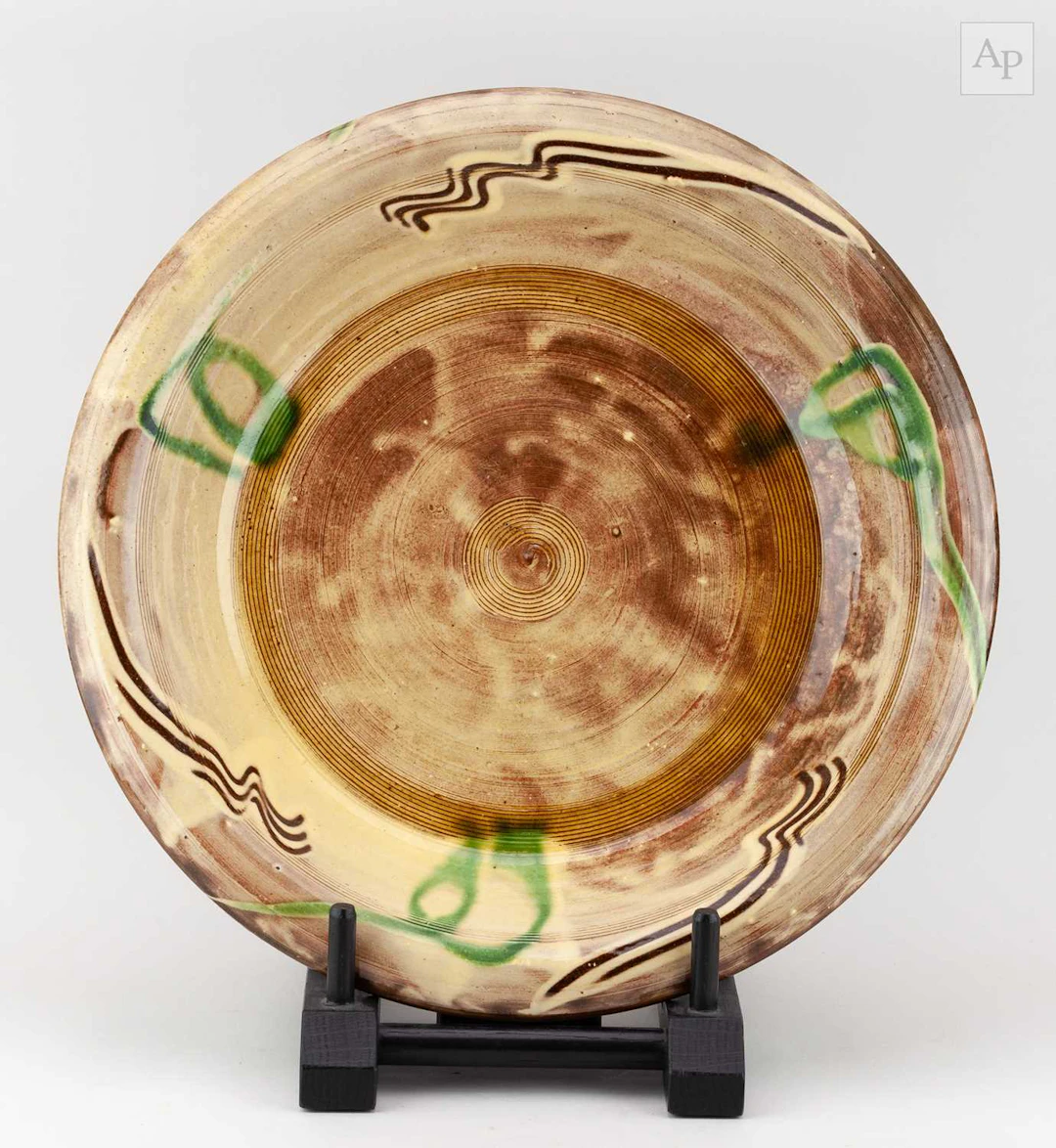 CLIVE BOWEN (born 1943); a slipware charger with trailed...