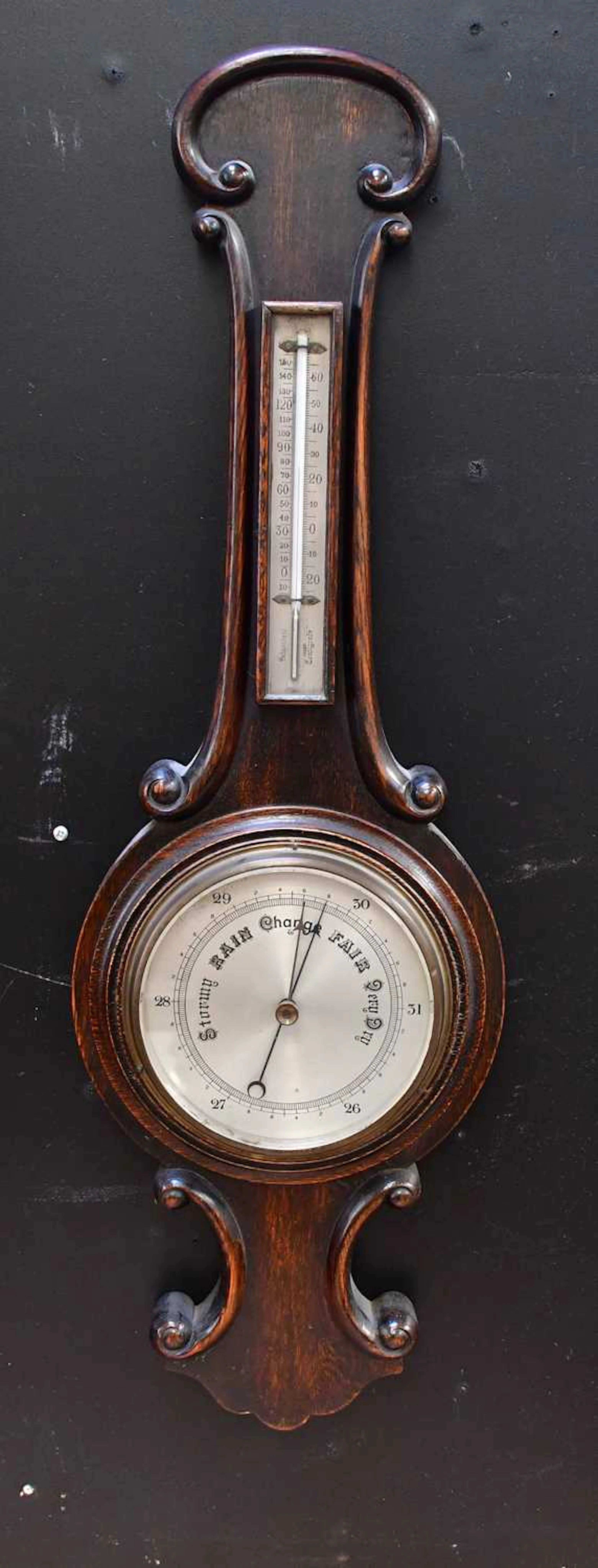 An early 20th century oak banjo barometer