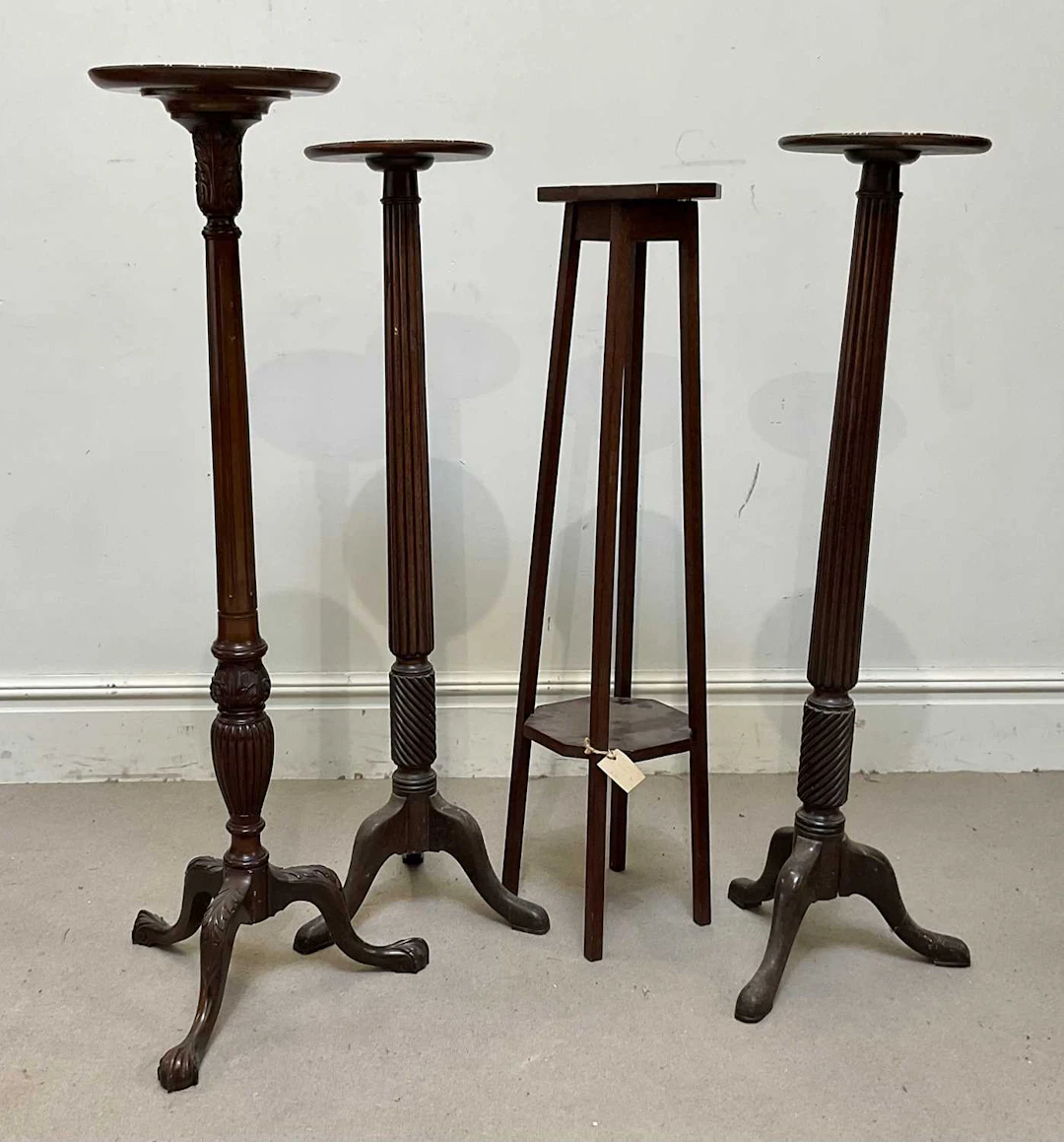 Four early 20th century mahogany jardiniere stands