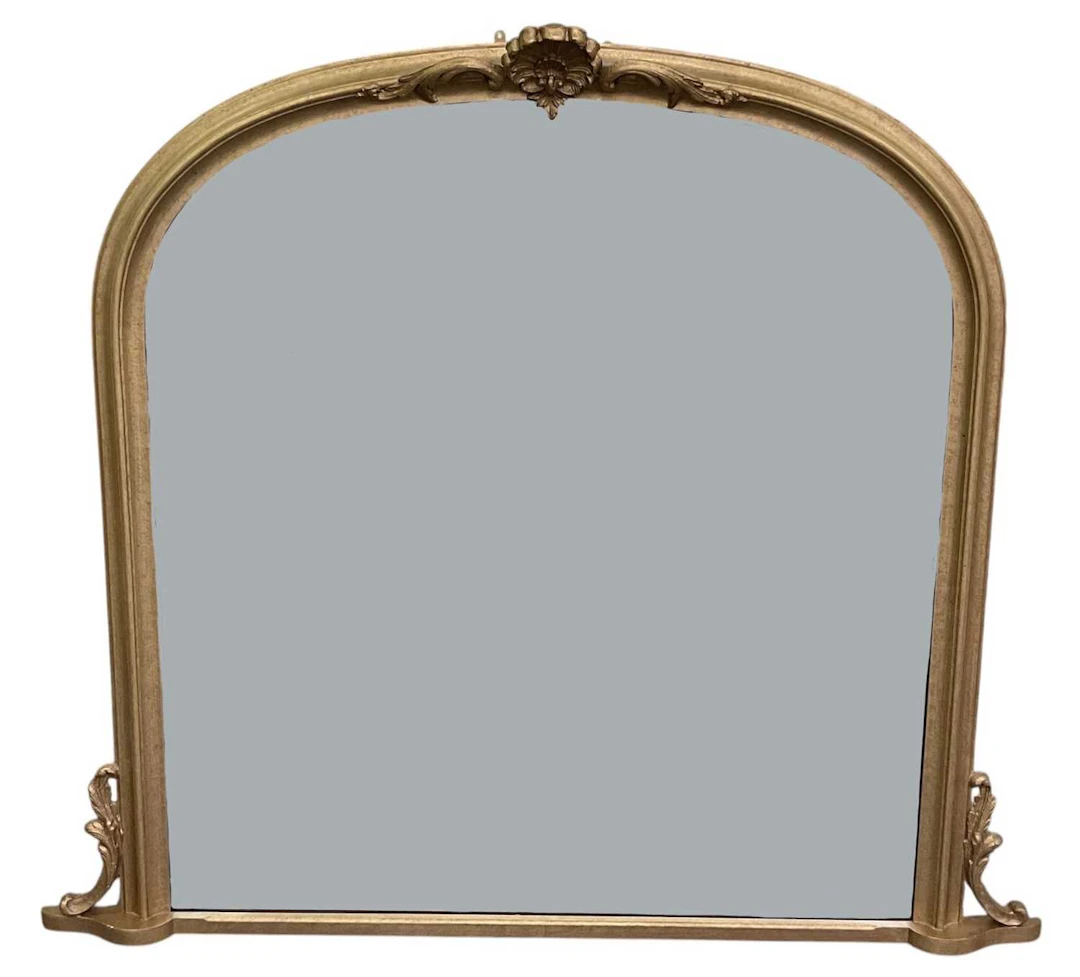 A reproduction gilt framed dome top overmantel wall mirror