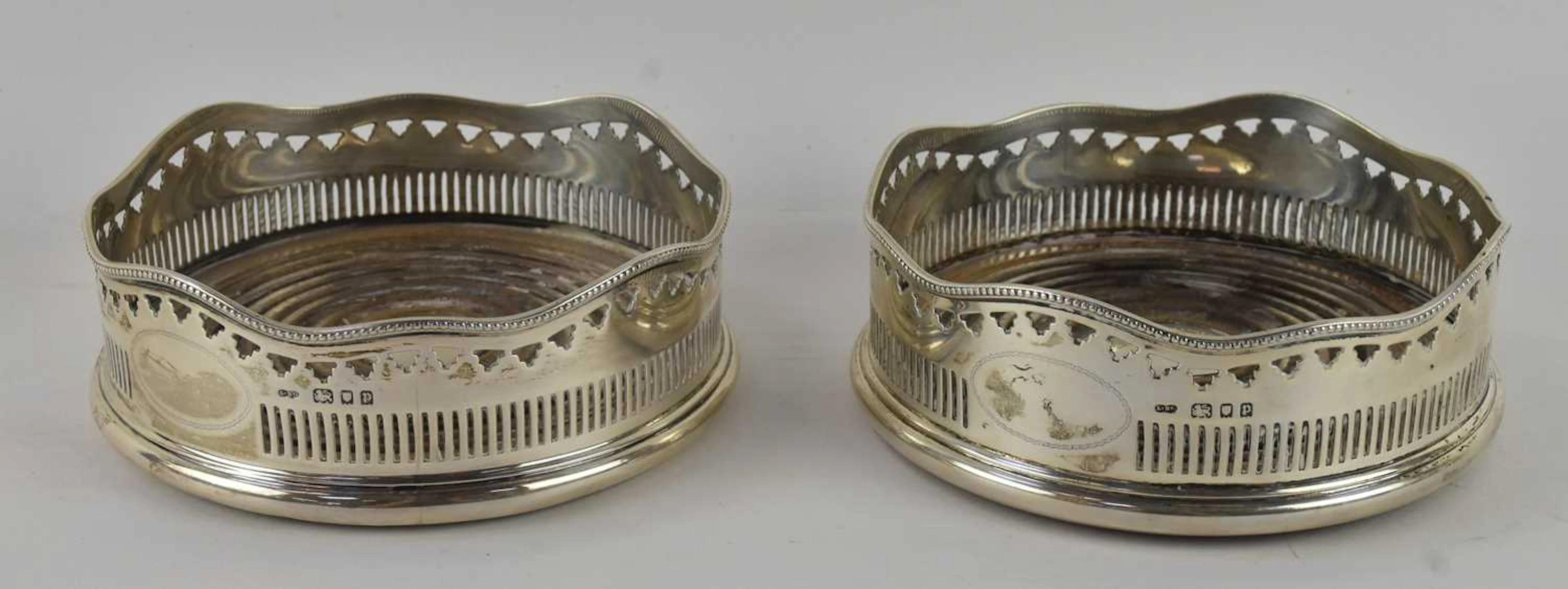 A pair of Victorian hallmarked silver circular wine coasters