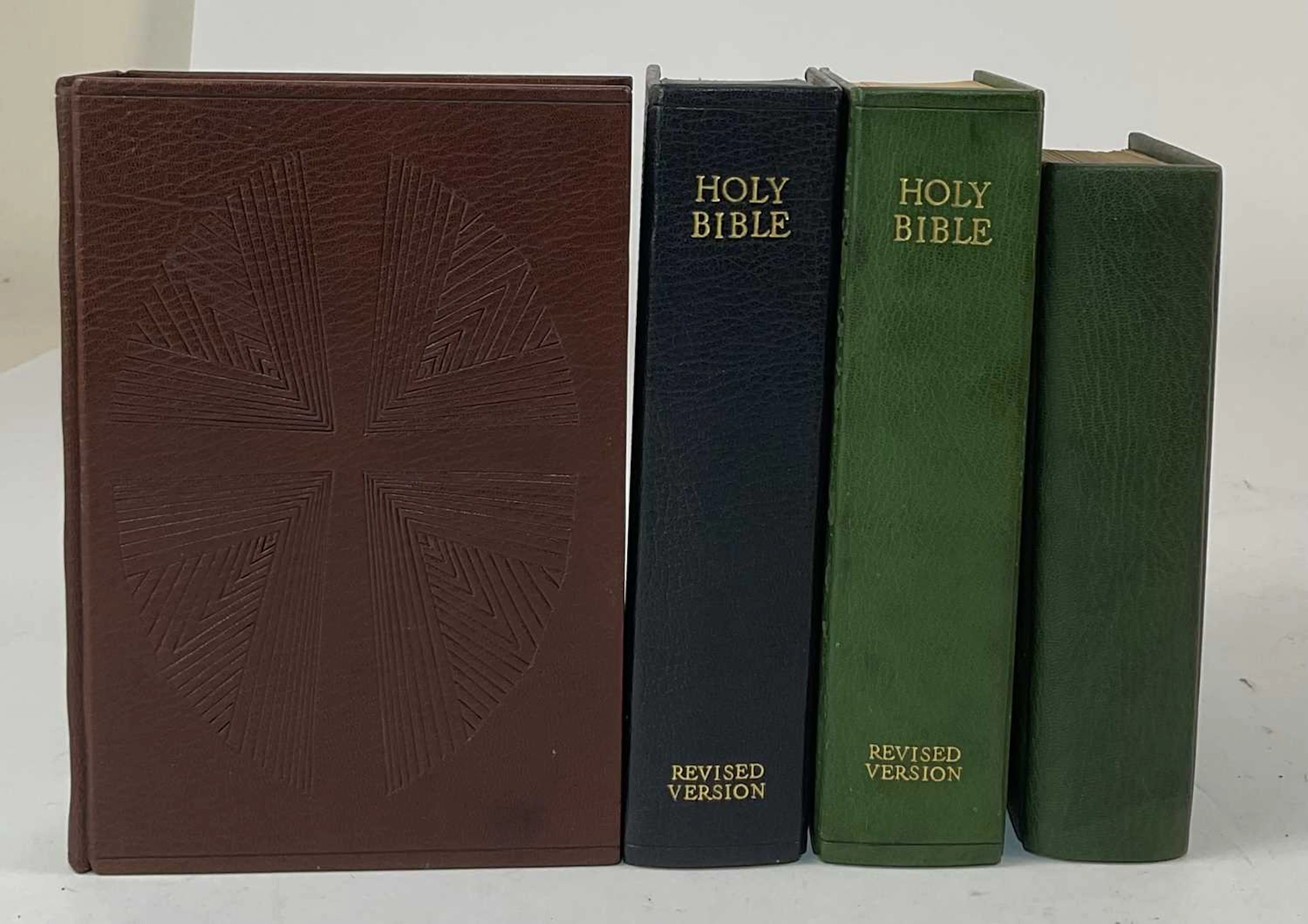 A collection of four modern Holy Bibles
