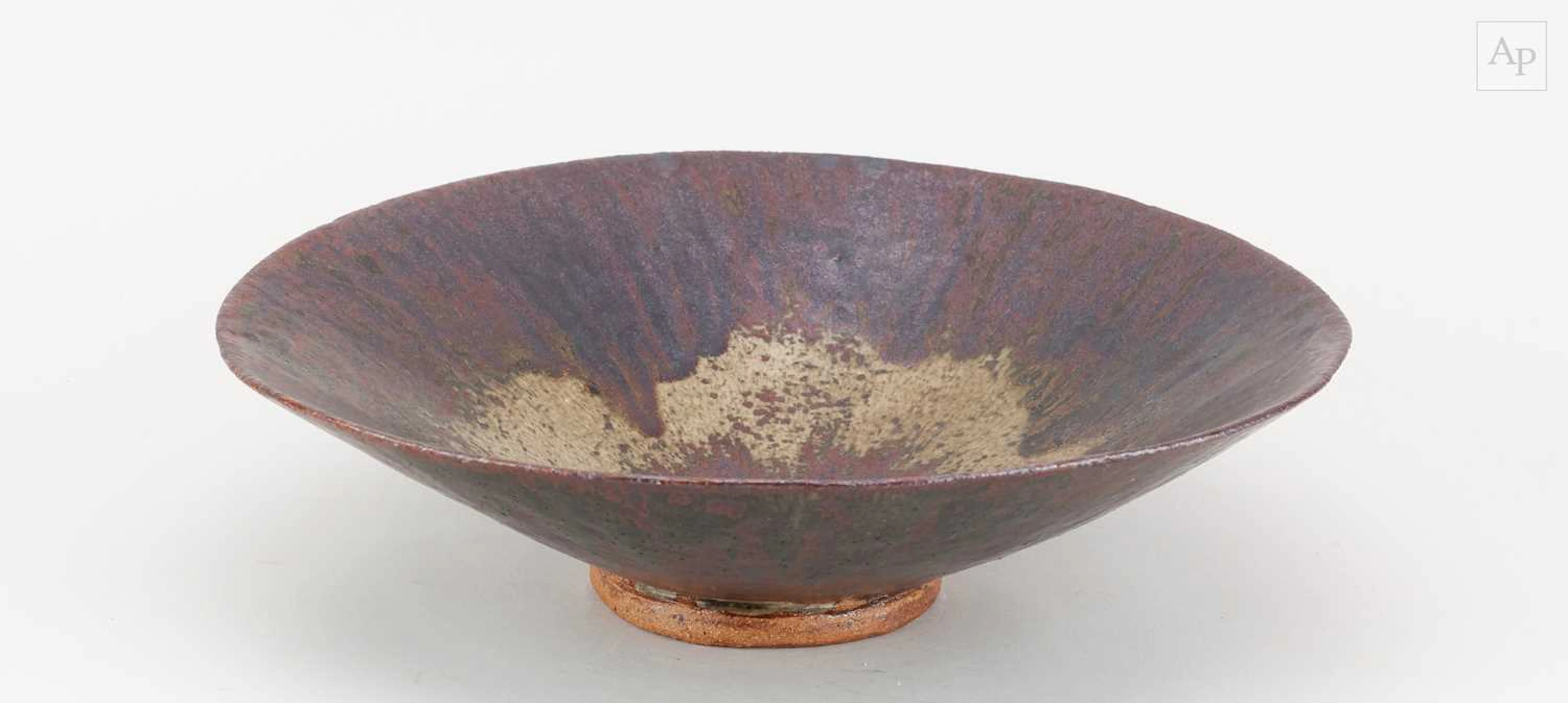 DAN ARBEID (1928-2010); a shallow stoneware bowl covered...