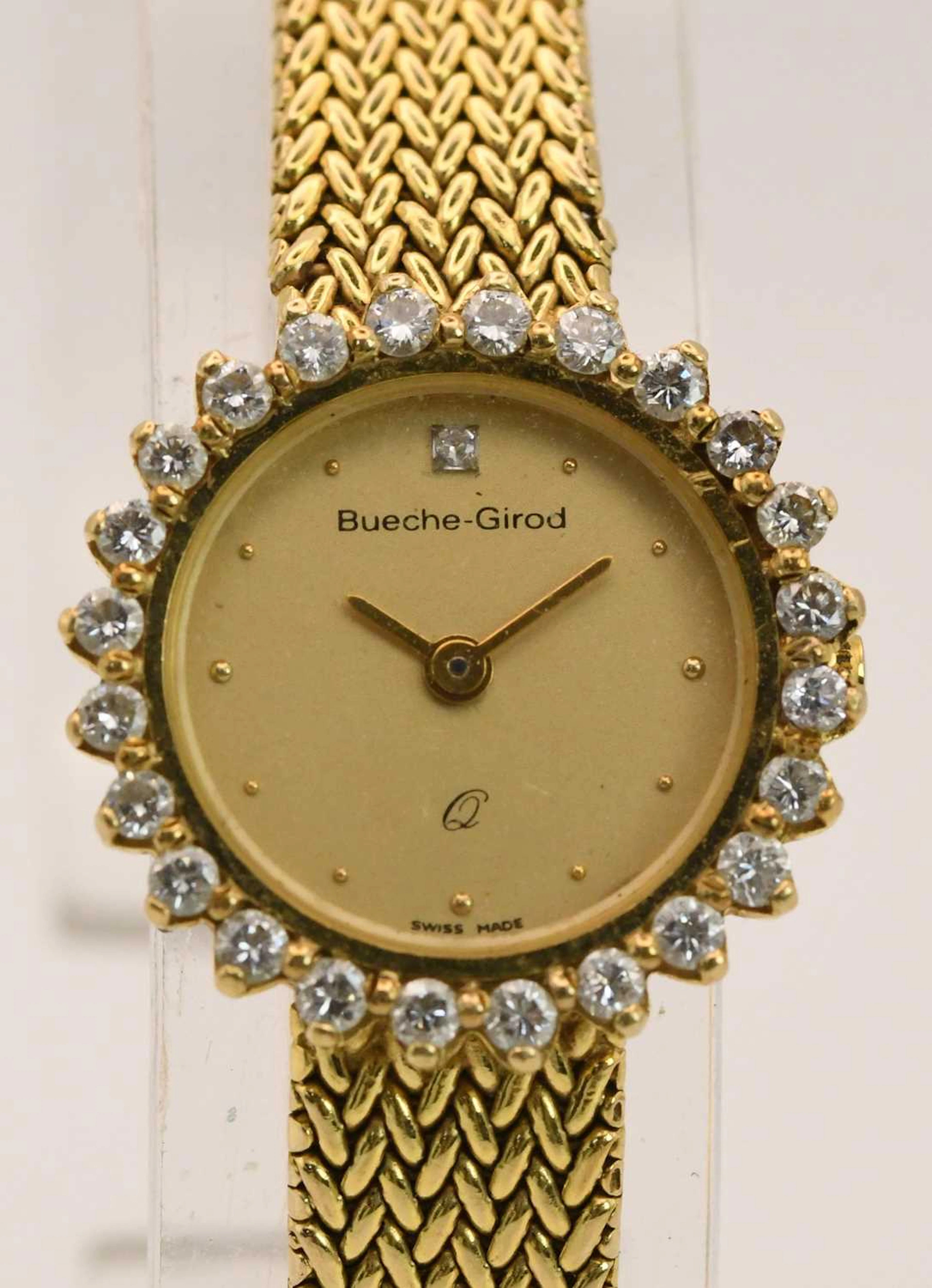 BUECHE-GIROD; a lady's 9ct yellow gold diamond encrusted wristwatch
