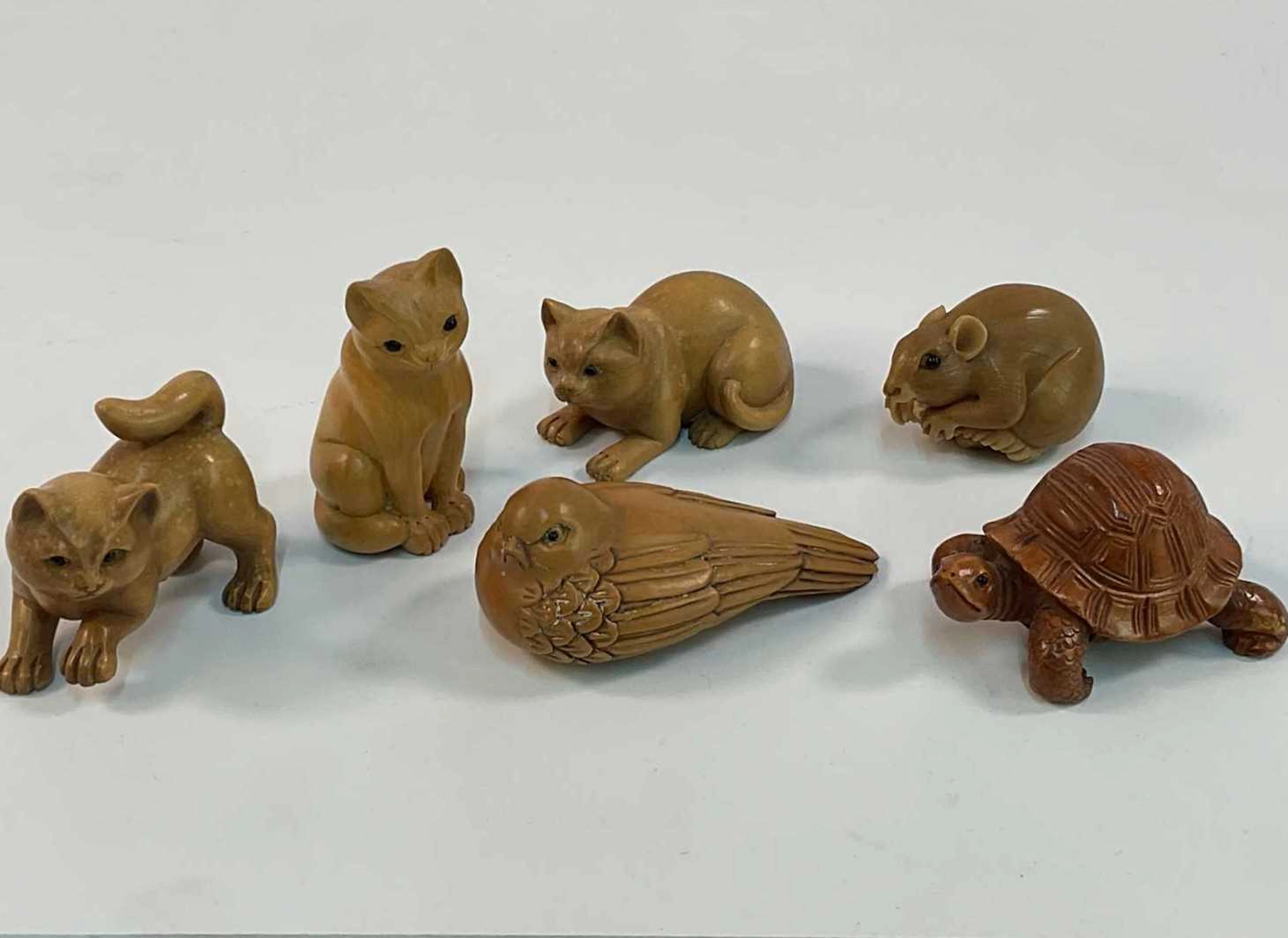 Six boxwood hand carved miniature animal figures in the style of netsuke
