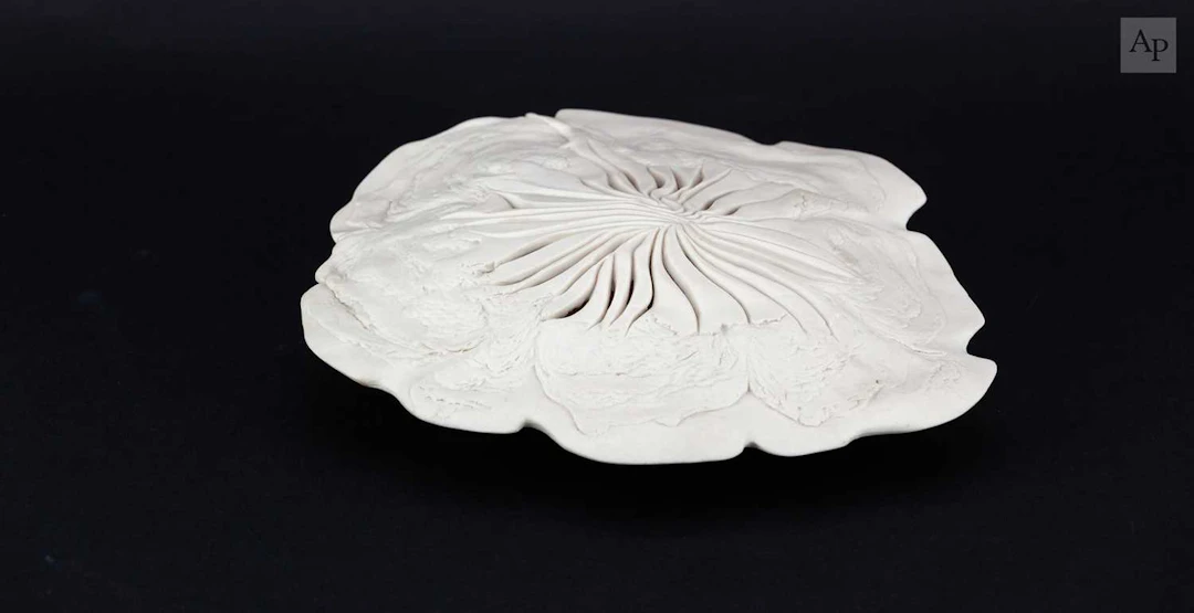 MAGGIE BARNES (born 1940); a carved porcelain crater bowl form