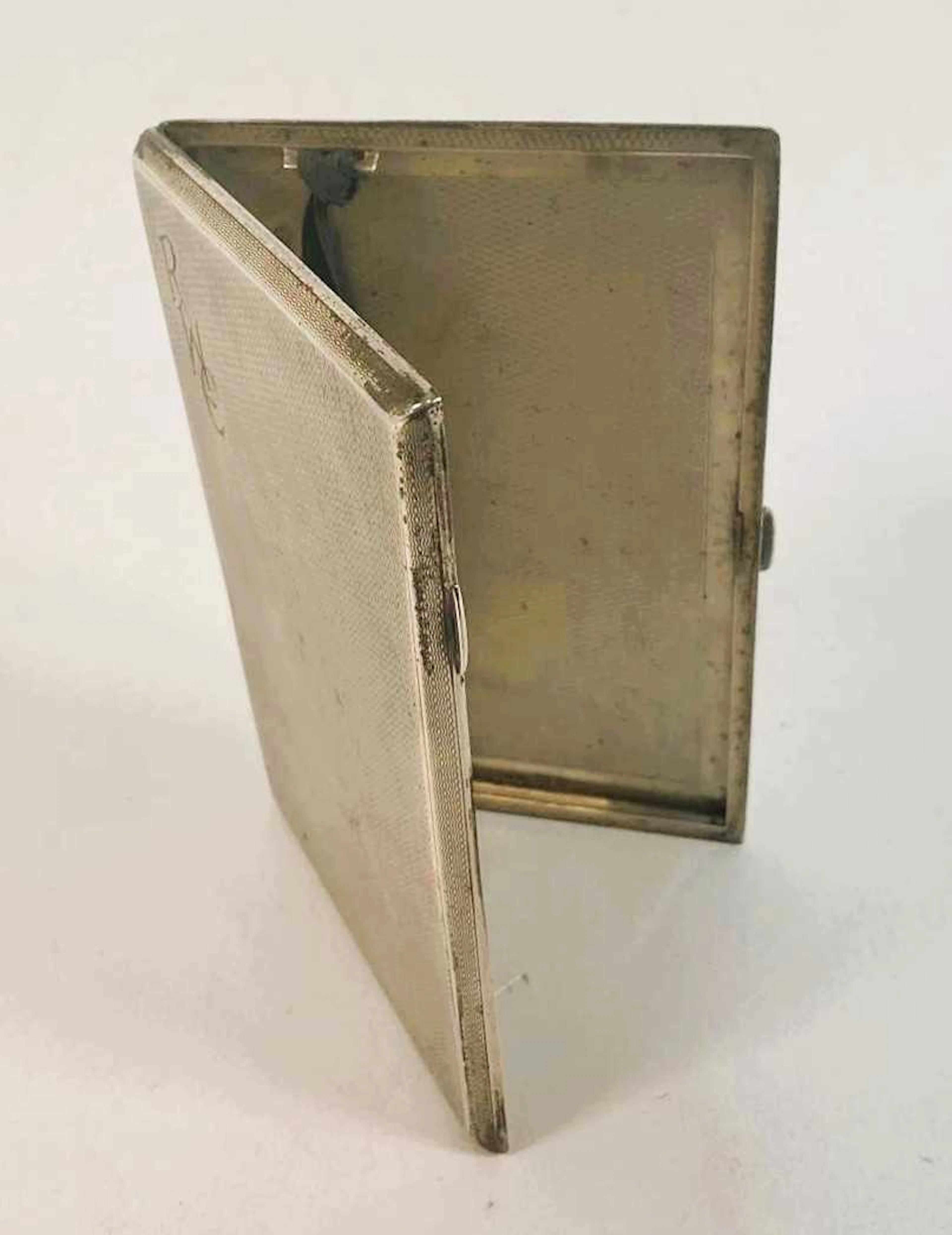 SM & CO; a George V hallmarked silver engine turned...