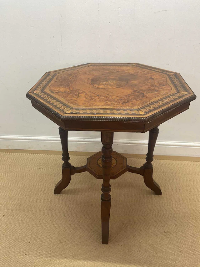 A 19th century veneered octagonal occasional table with undertier