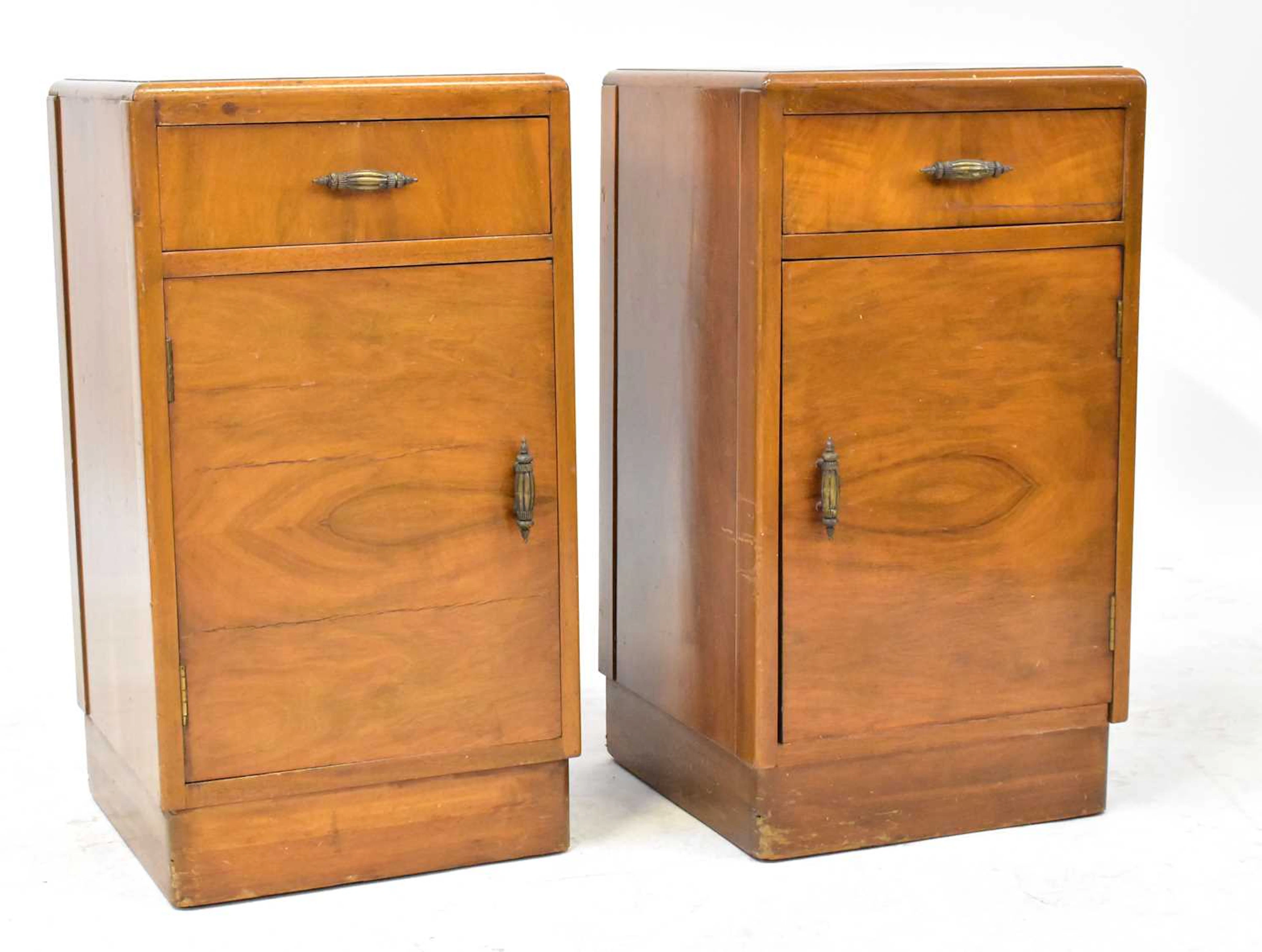 A pair of 1950s walnut bedside tables