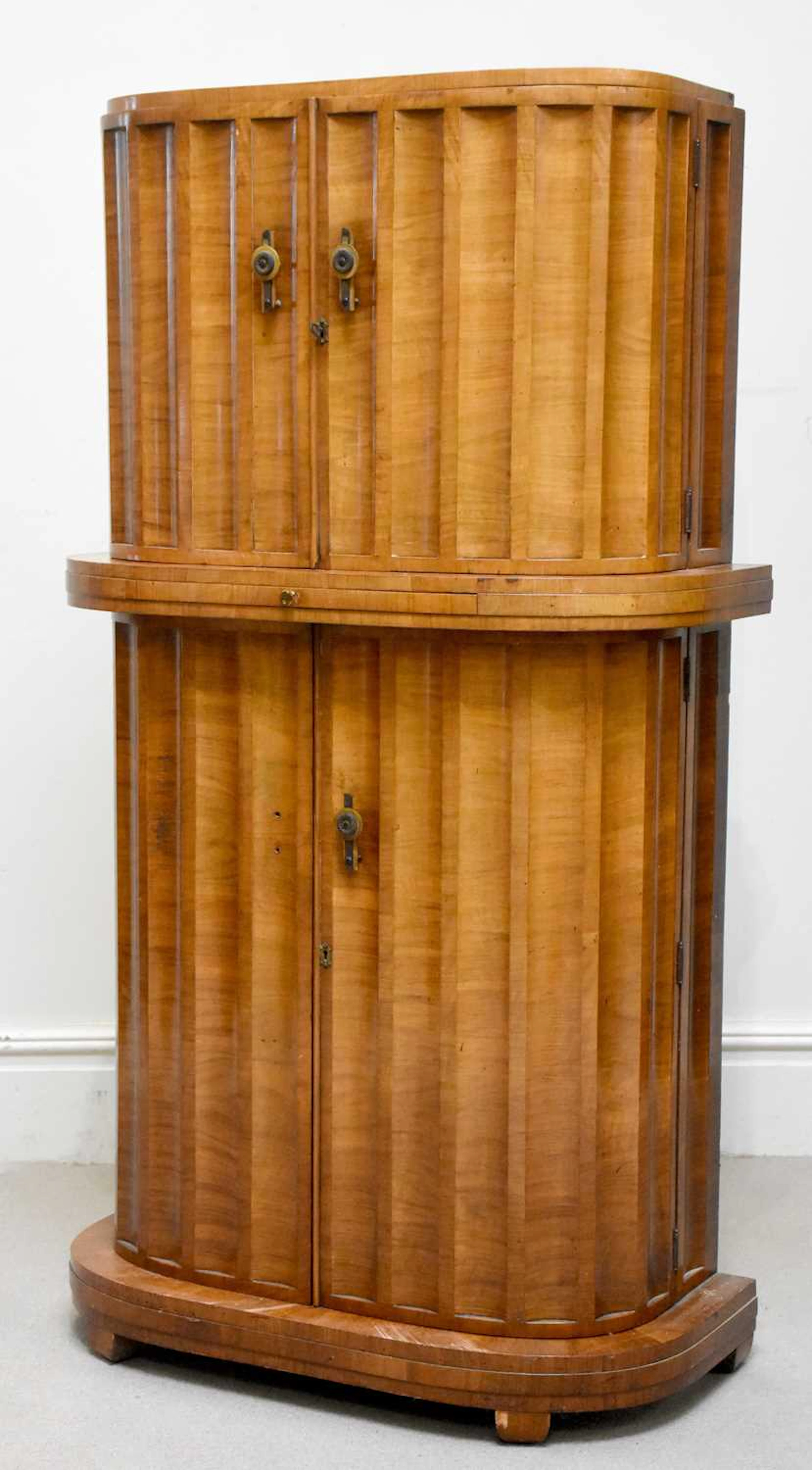 HARRY & LOU EPSTEIN; a good Art Deco walnut demi-lune cocktail cabinet