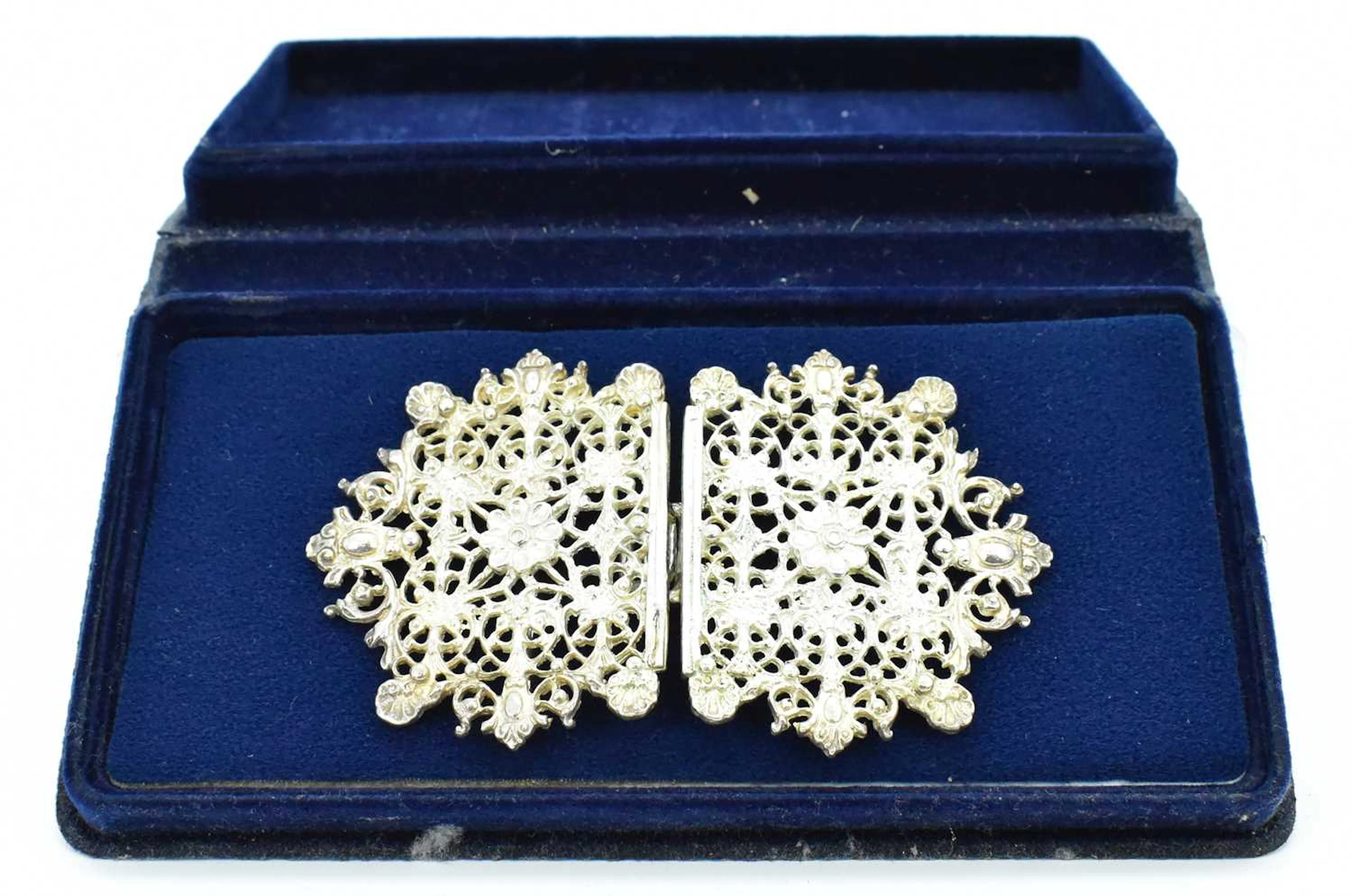 A Queen Elizabeth II floral nurse's silver buckle