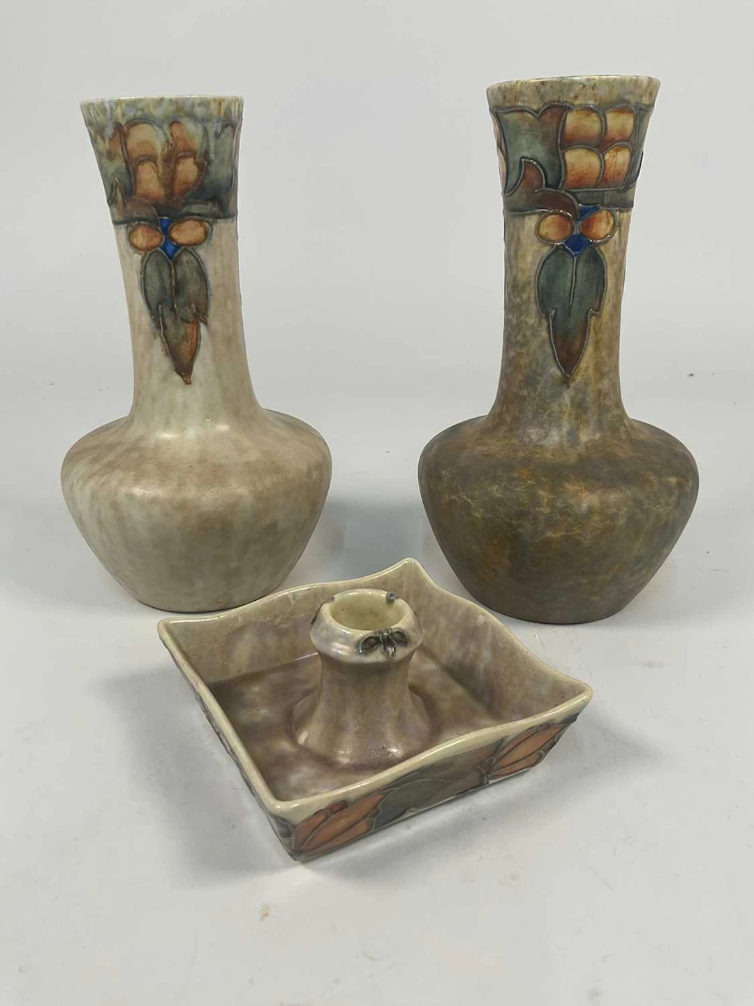 CRANSTON POTTERY; a vase decorated in dark grey with a coloured motif to the top