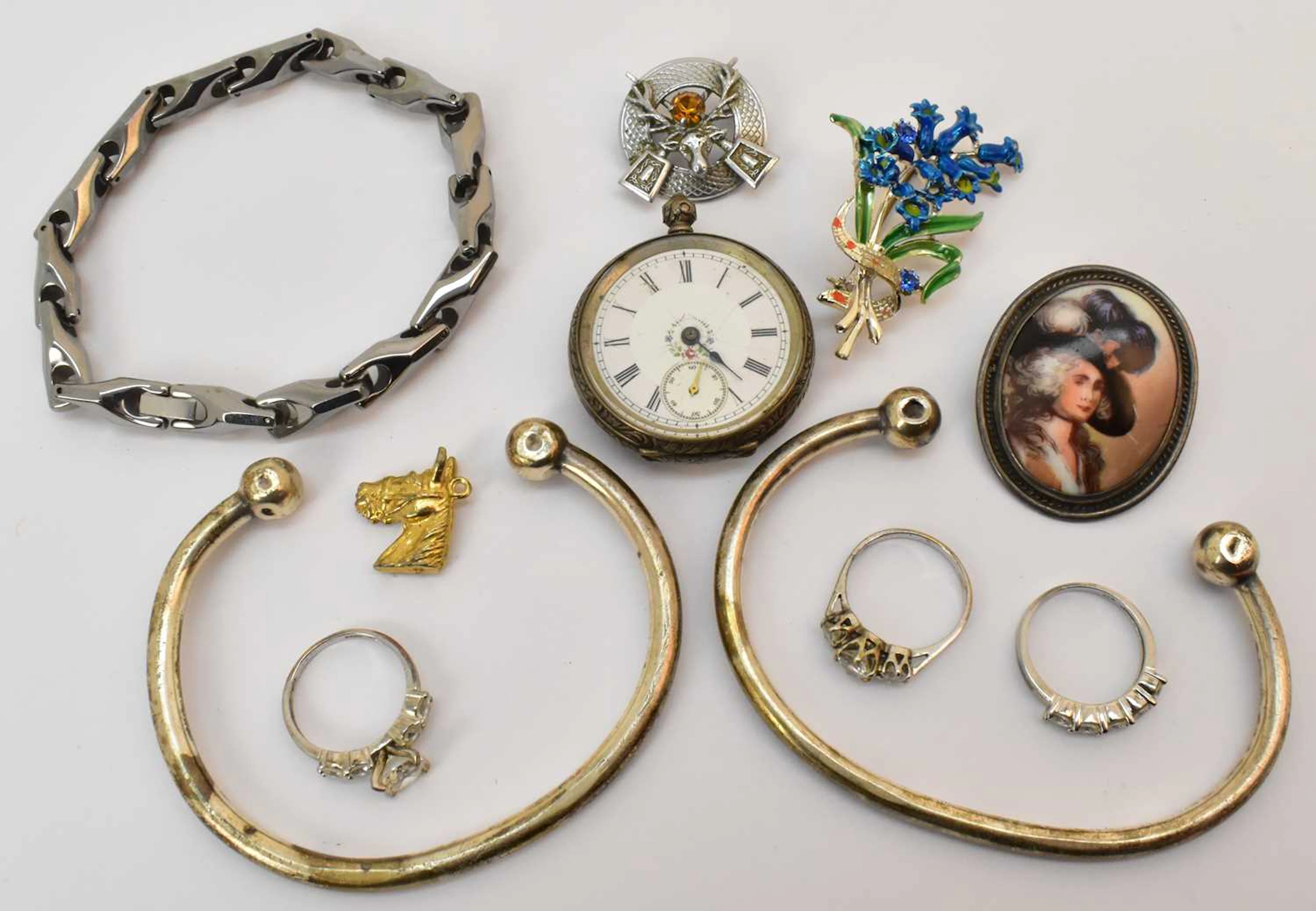 Various items of costume jewellery including two silver torque bracelets
