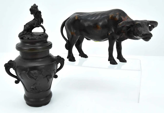 A 20th century bronzed koro with a mythical creature
