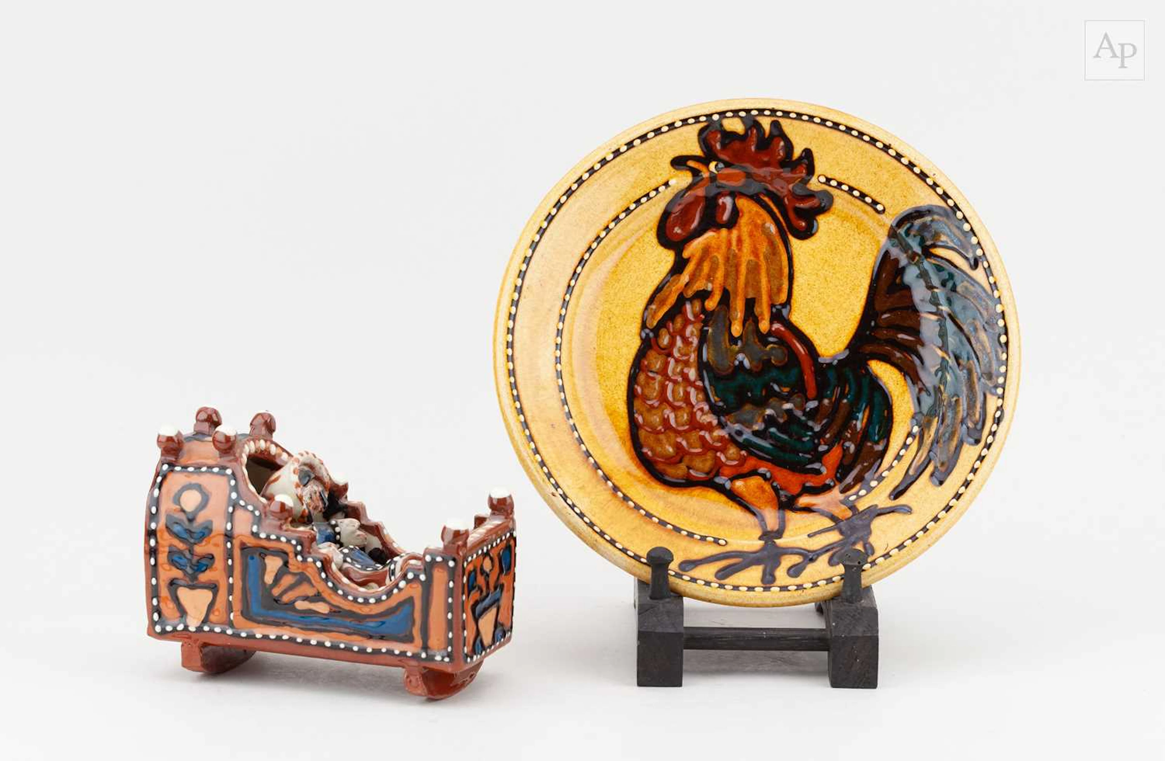 MARY WONDRAUSCH (1923-2016); a slipware cradle and baby