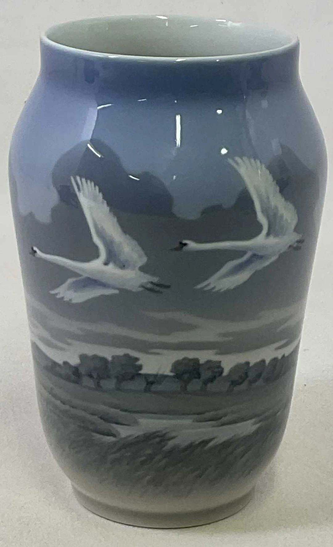ROYAL COPENHAGEN; a large vase decorated with two swans in flight
