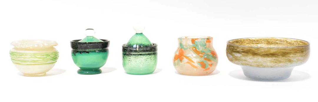 Five pieces of studio glassware including a Loetz-style overlaid glass bowl