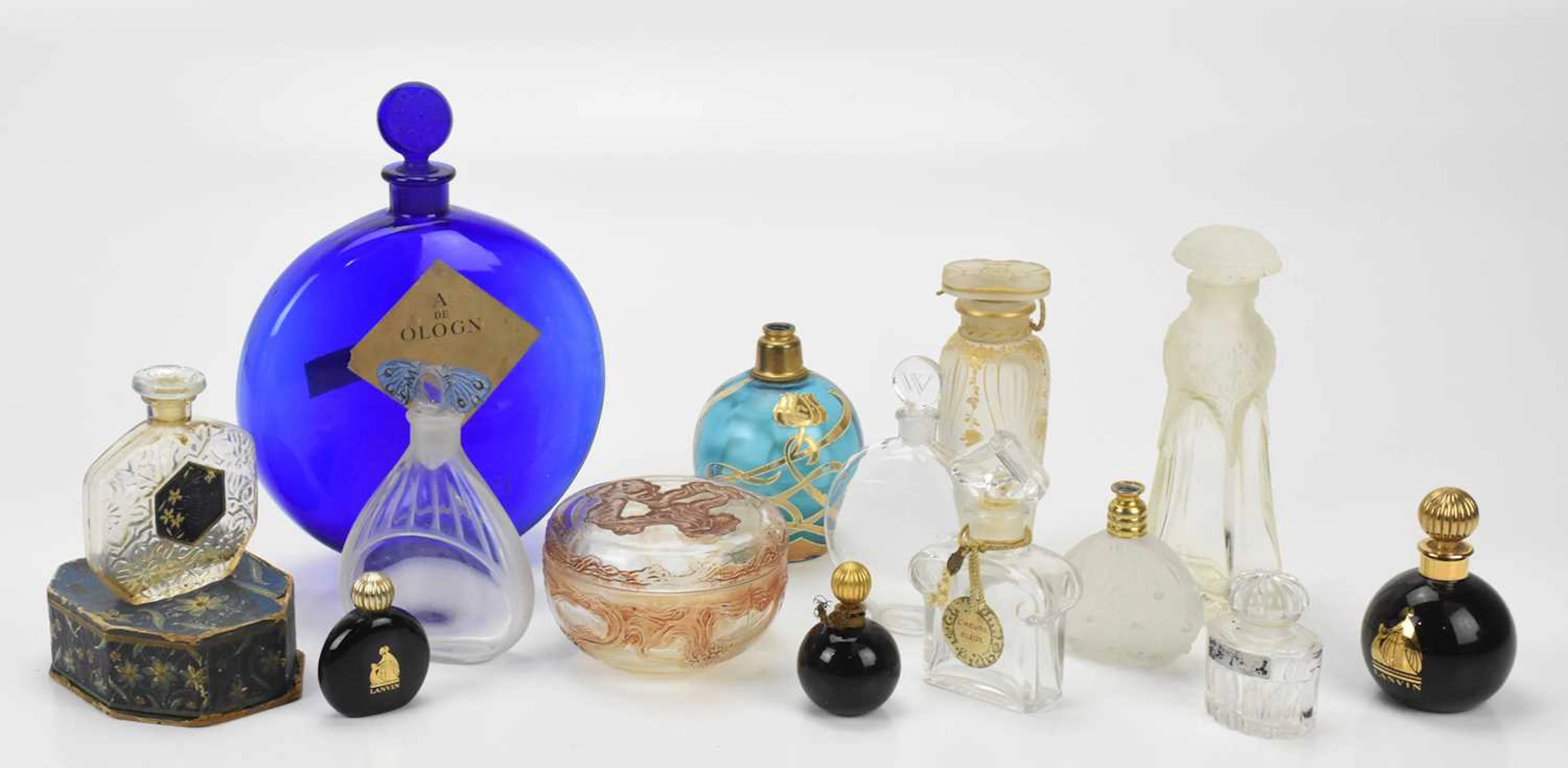 A good collection of predominantly French glass perfume bottles and trinket box