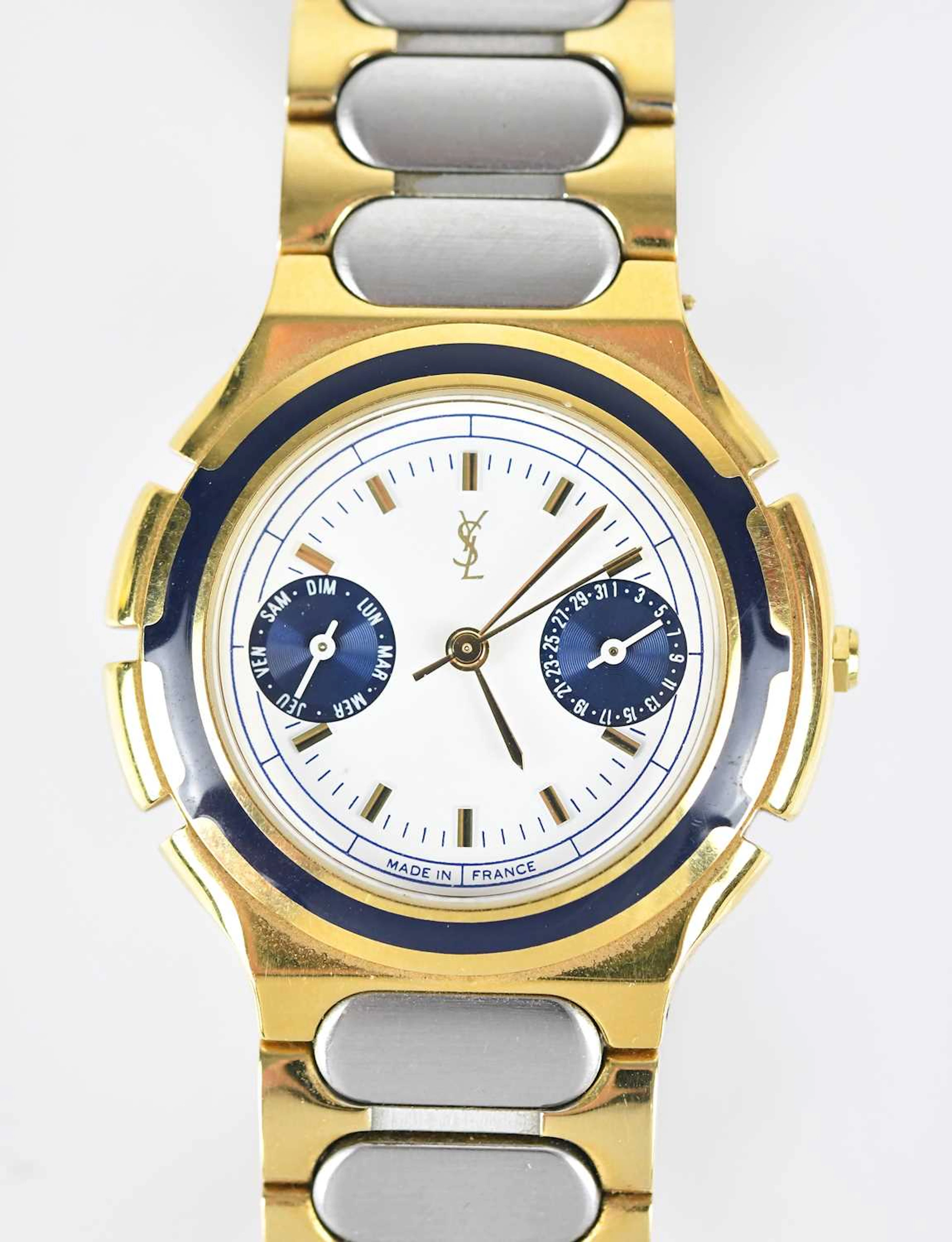 YVES SAINT LAURENT; a two tone 18ct gold plated and...