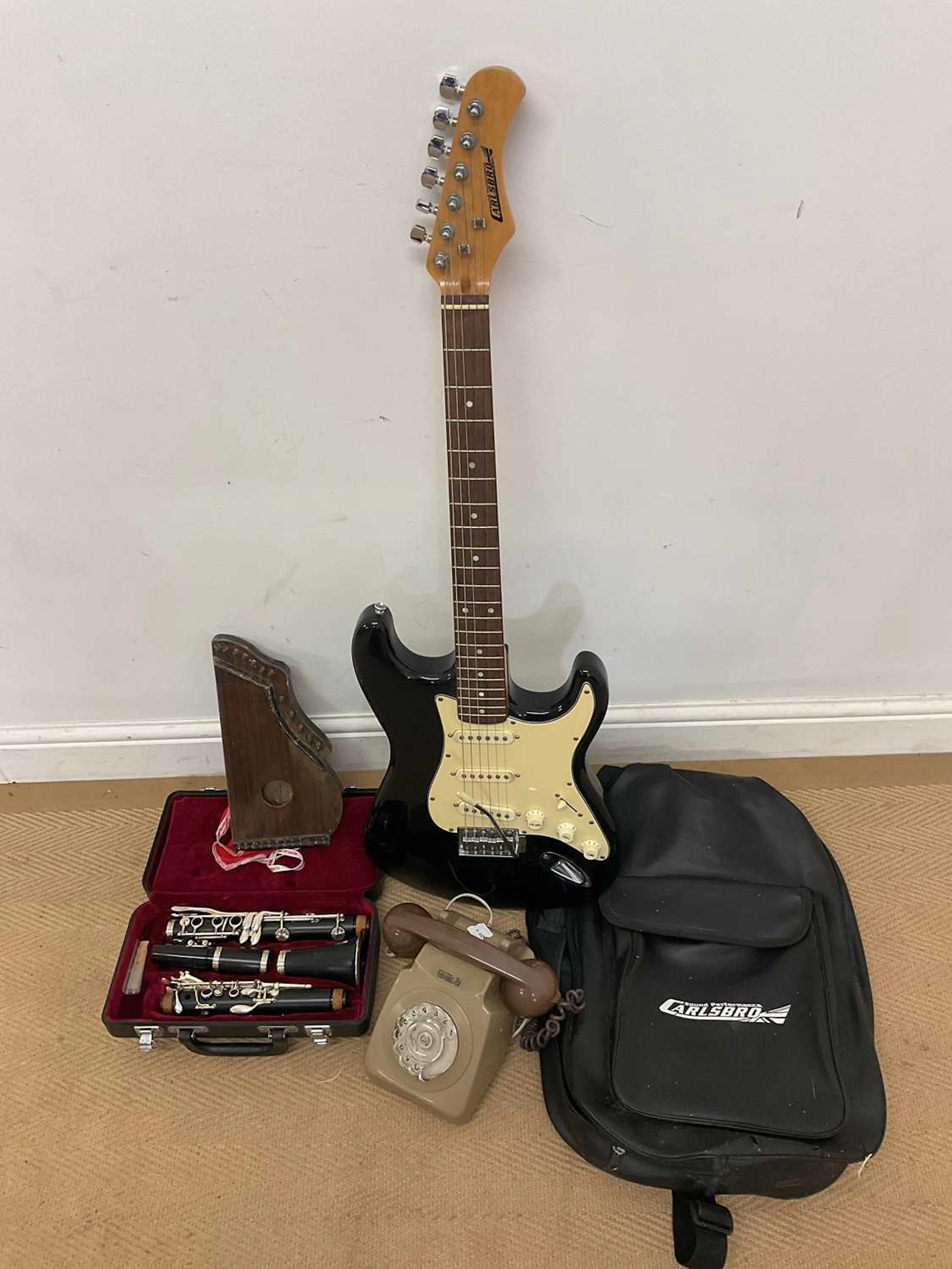 A cased electric guitar