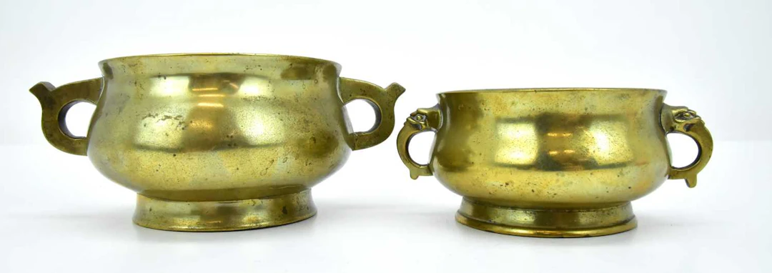 Two late 19th/early 20th century brass censers