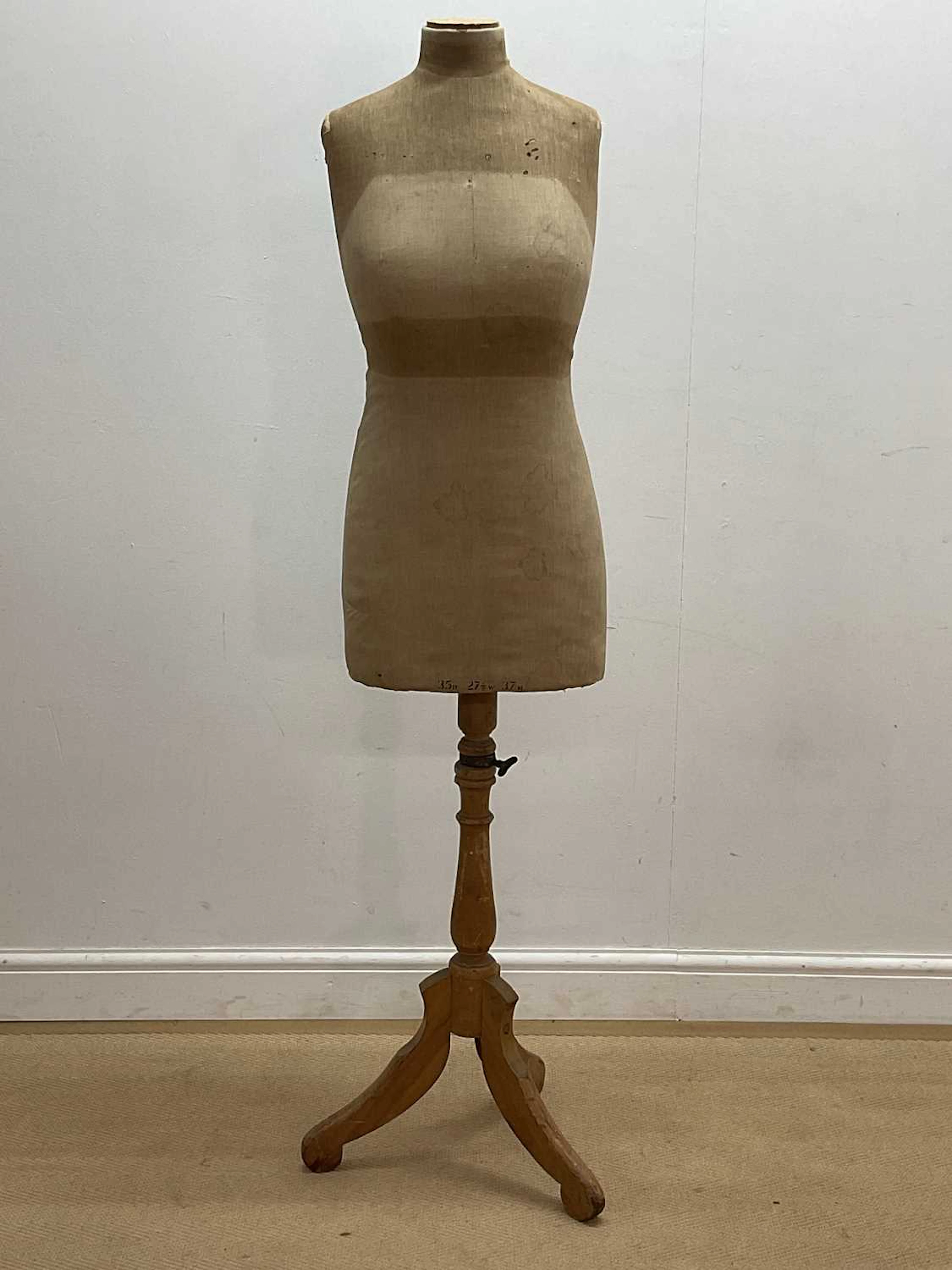 A mid 20th century linen covered dressmaker's mannequin...