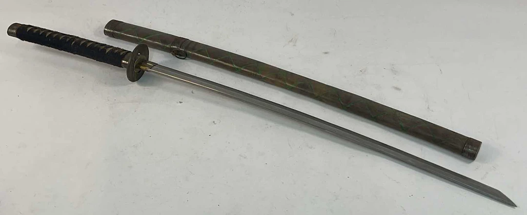 A Katana style sword in a painted wooden sheath with...